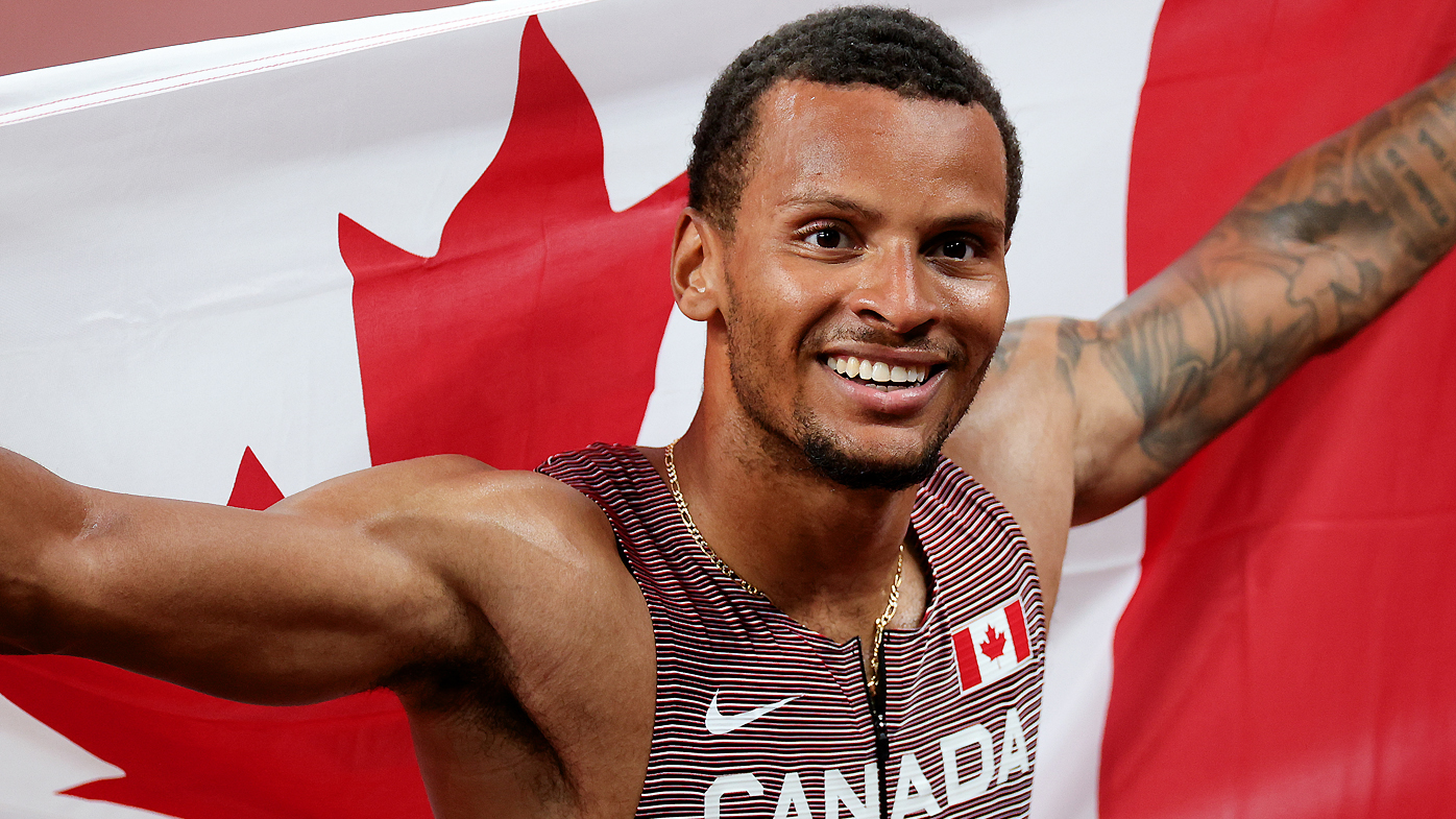 Andre De Grasse of Team Canada celebrates winning the Men's 200m Final 