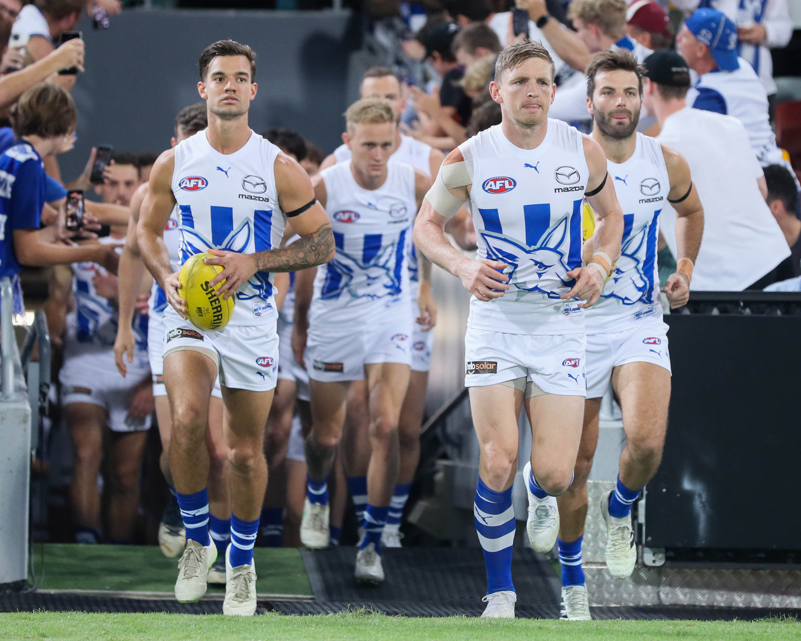 Jack Ziebell of the Kangaroos leads the team out.