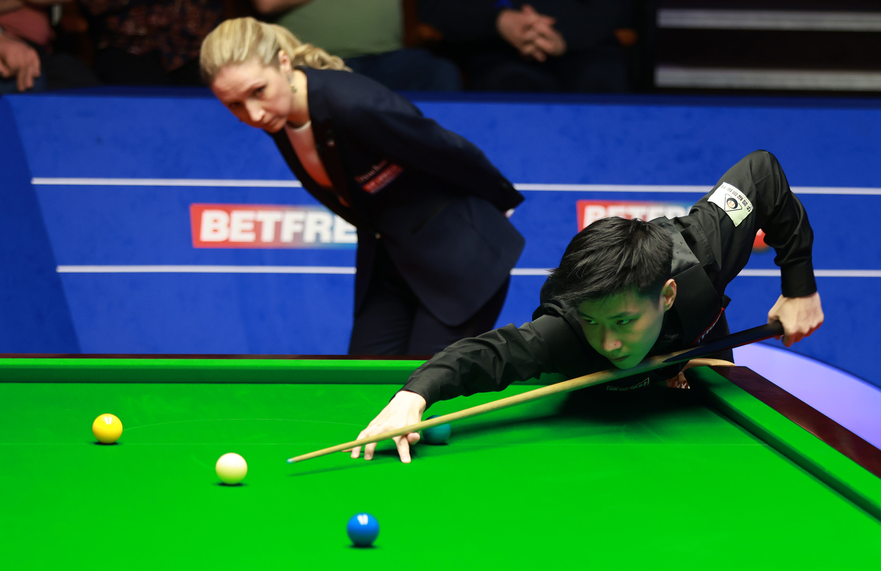 Zhao Xintong against Stephen Maguire during day seven of the Betfred World Snooker Championships at The Crucible, Sheffield. Picture date: Friday April 22, 2022. (Photo by Ian Hodgson/PA Images via Getty Images)