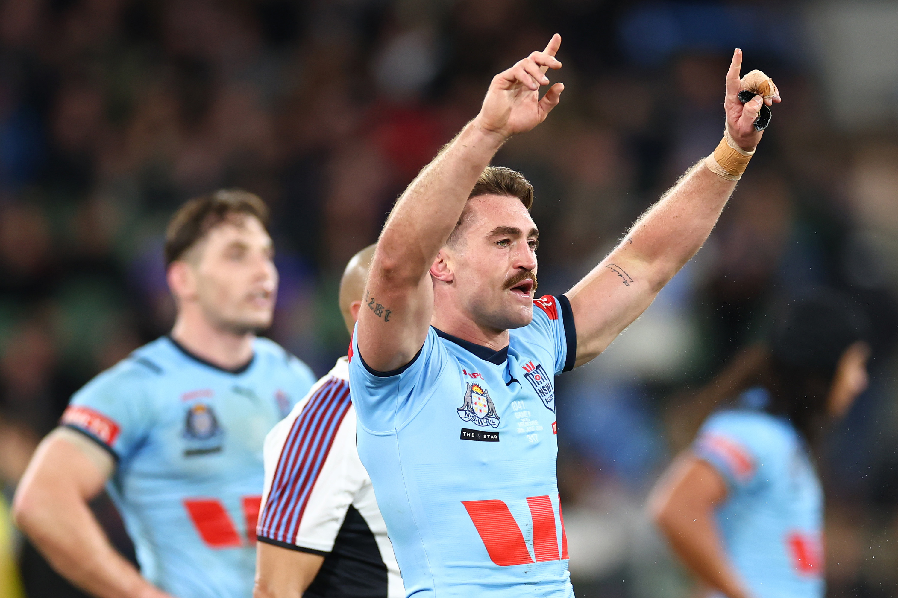 Connor Watson of the Blues celebrates victory in his Origin debut.