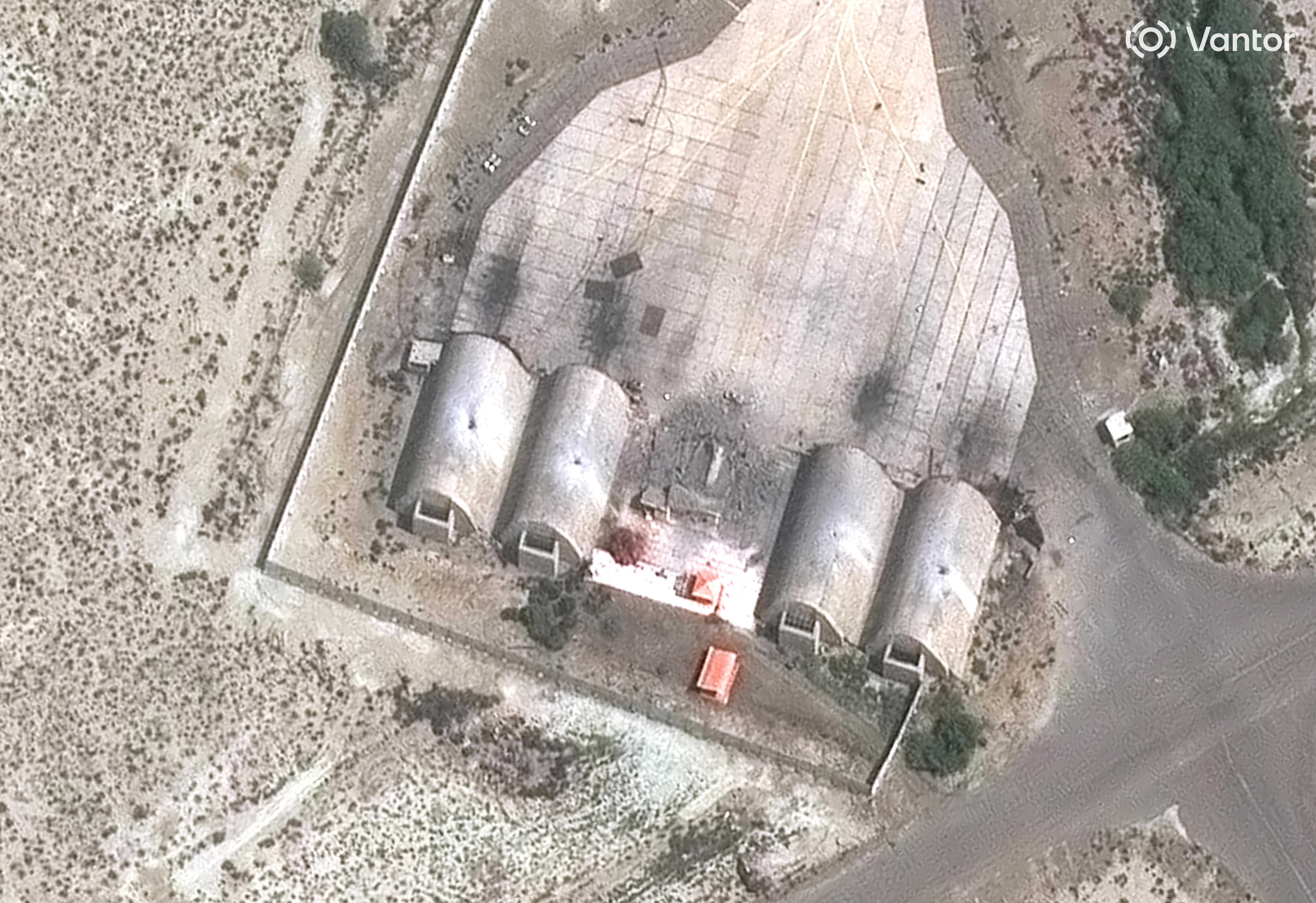 In this satellite image provided by Vantor, damage from precision airstrikes on aircraft shelters is seen at the Konarak Airbase, Iran, Sunday, March 1, 2026. 
