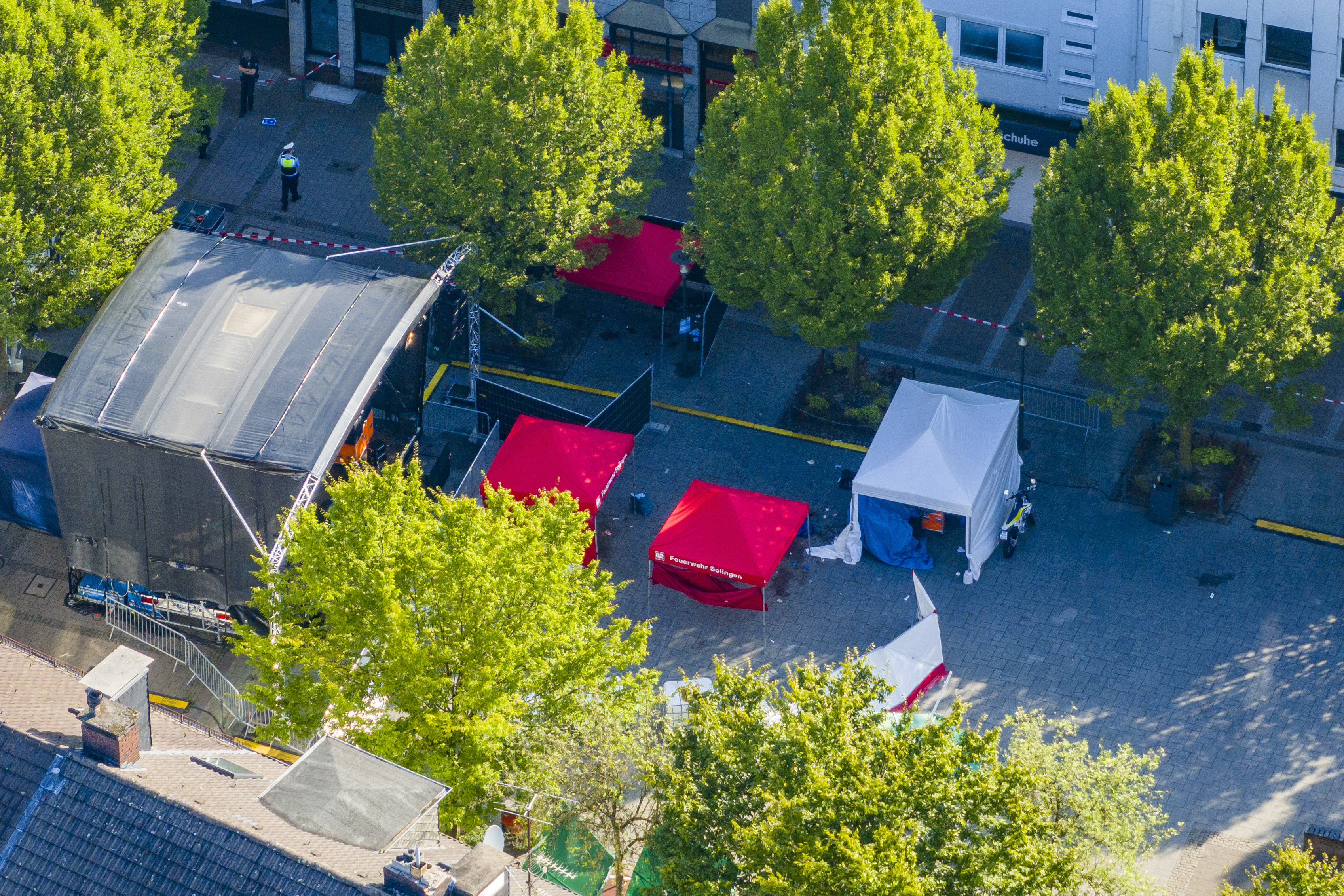 Emergency services tents stand in front of the stage in Solingen city centre, Germany, Saturday Aug. 24, 2024, after three people were killed and at least eight people were wounded in a knife attack Friday night at the festival. 