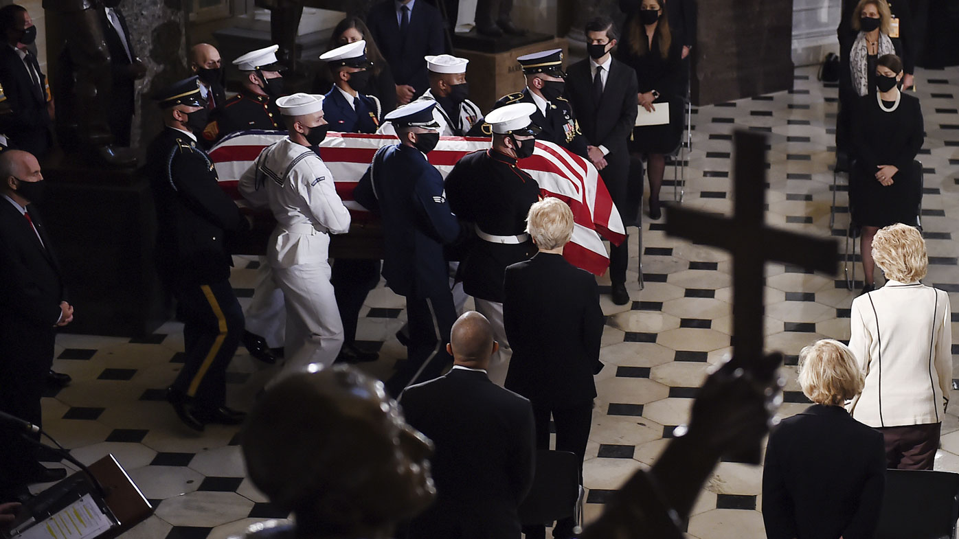 A joint services military honour guard carries the flag-draped casket of Justice Ruth Bader Ginsburg to lie in state in Statuary Hall of the US Capitol, Friday, Sept. 25, 2020 in Washington. 
