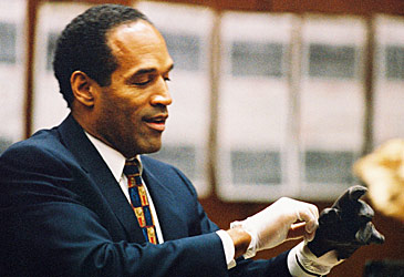 OJ Simpson putting on glove (Getty)