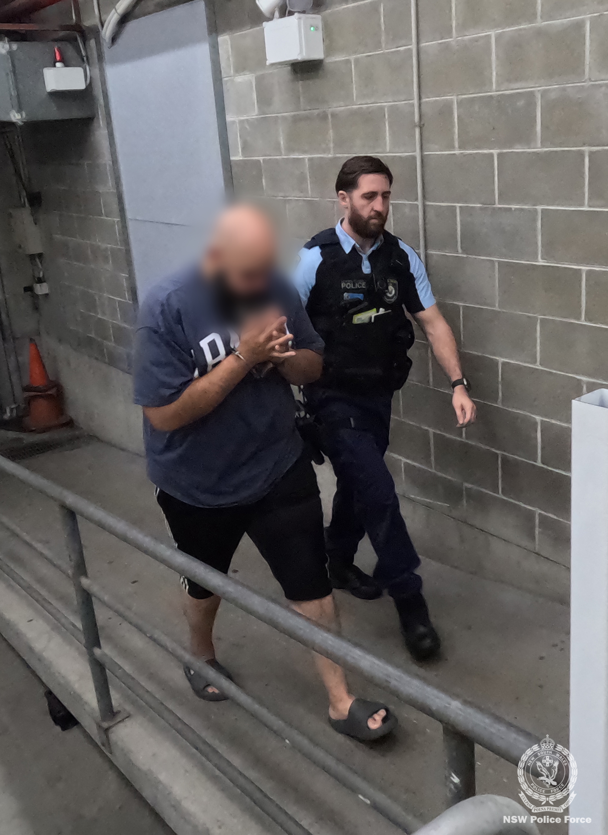 Two men, a﻿ staff member and a contractor, have been arrested for allegedly stealing almost $1.4 million intended for schools in Sydney. 