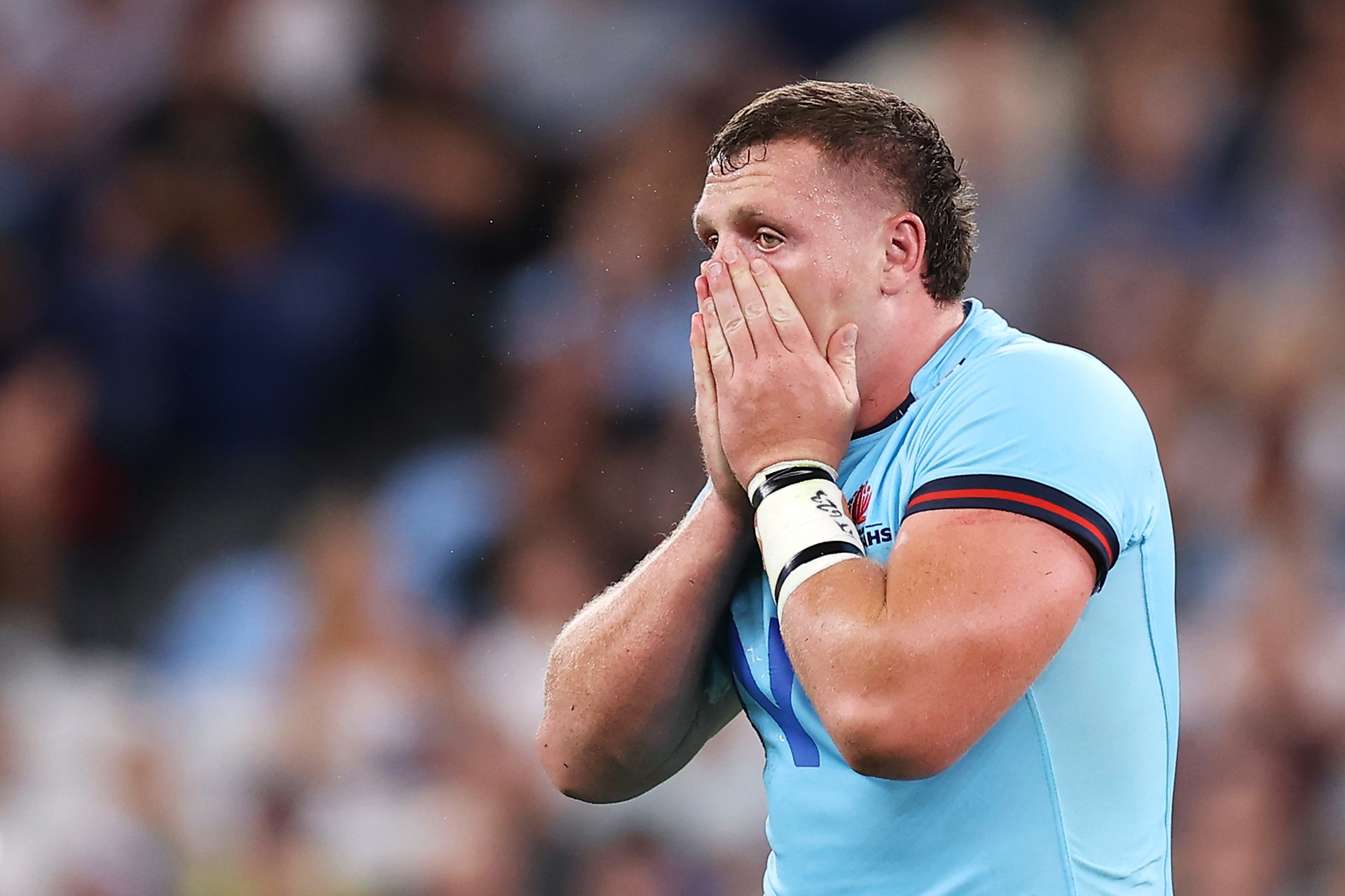 Angus Bell of the Waratahs reacts to his toe injury.