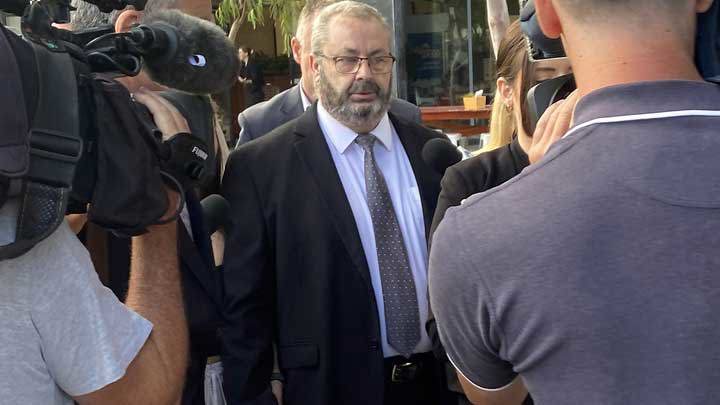 Bus driver Brett Button (centre) outside Newcastle Court House in Newcastle, Wednesday, March 13, 2024. 