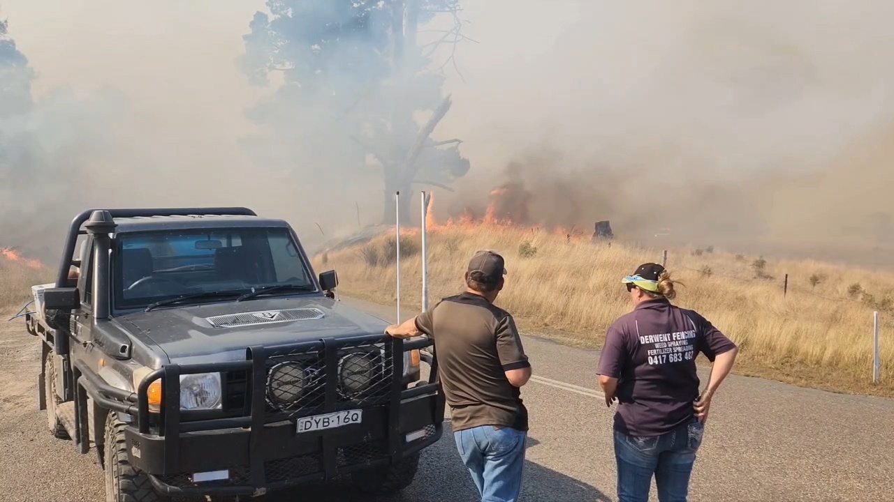 An emergency warning has been issued for residents in the New South Wales town of Curraweela as a grass fire burns out of control.