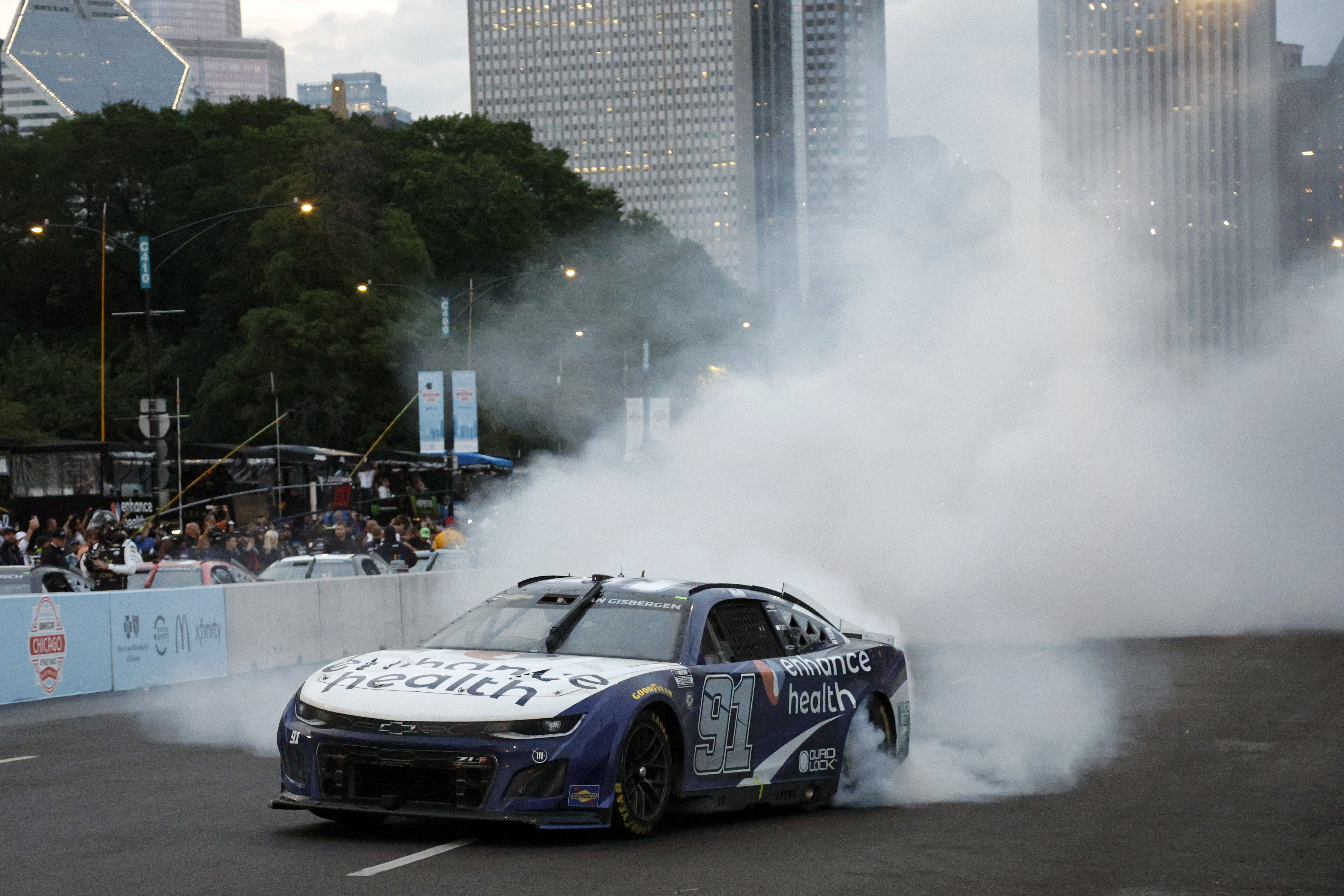 Shane Van Gisbergen celebrates victory with a burnout on the streets of Chicago.