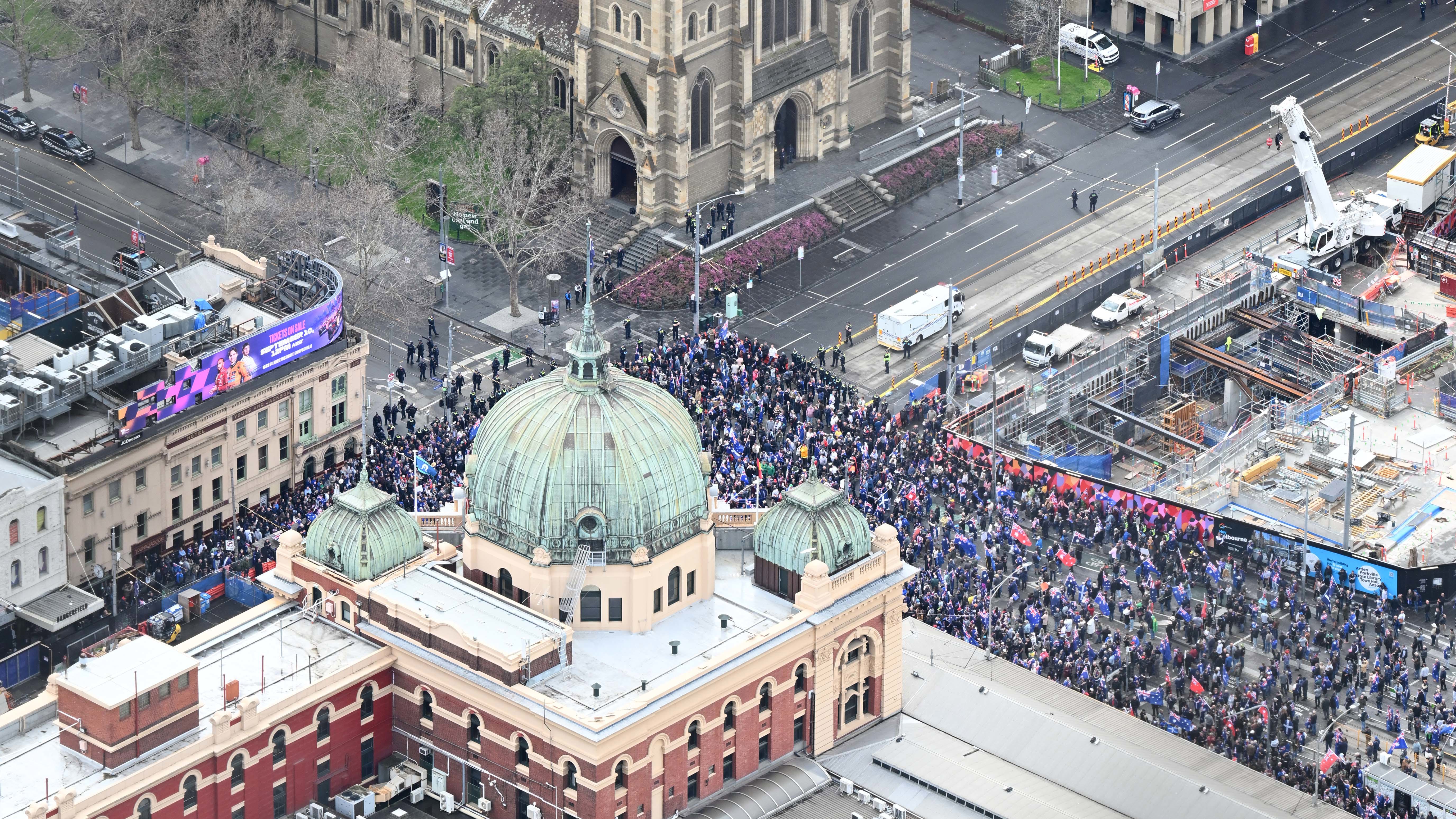 Protesters at the anti - immigration March for Australia protest outside Flinders St Station, Melbourne.