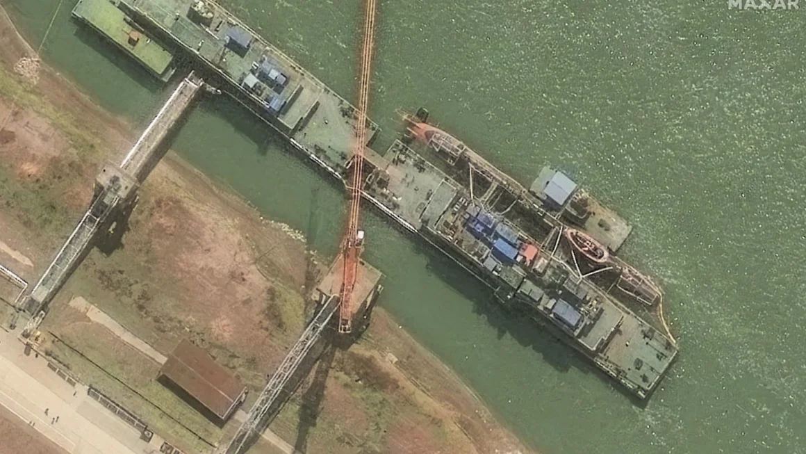 A satellite image from Maxar shows the Zhou class sub sitting at the pier on March 10. Courtesy Maxar Technologies