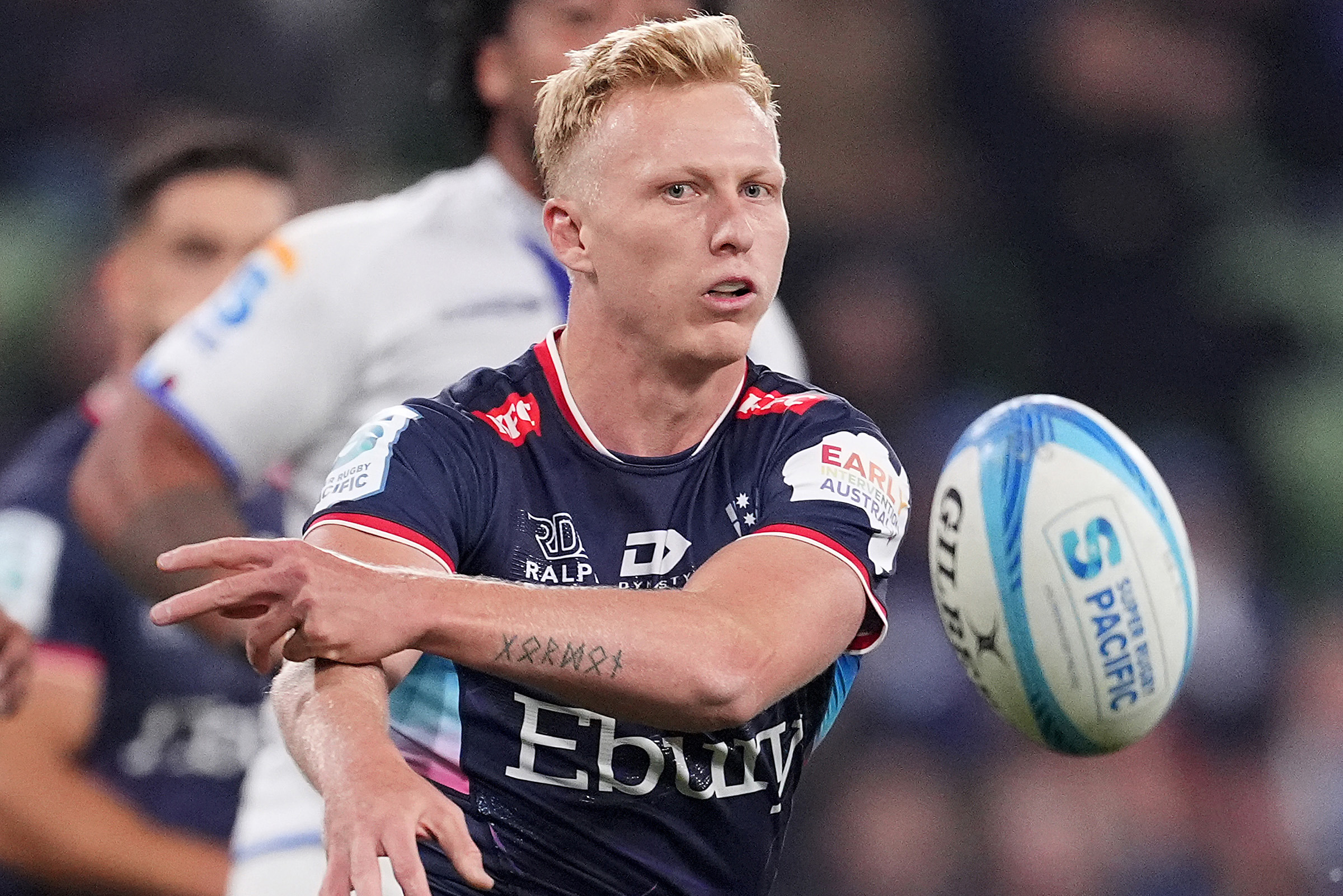 Carter Gordon of the Rebels passes the ball during the round 11 Super Rugby Pacific match between Melbourne Rebels and Blues.