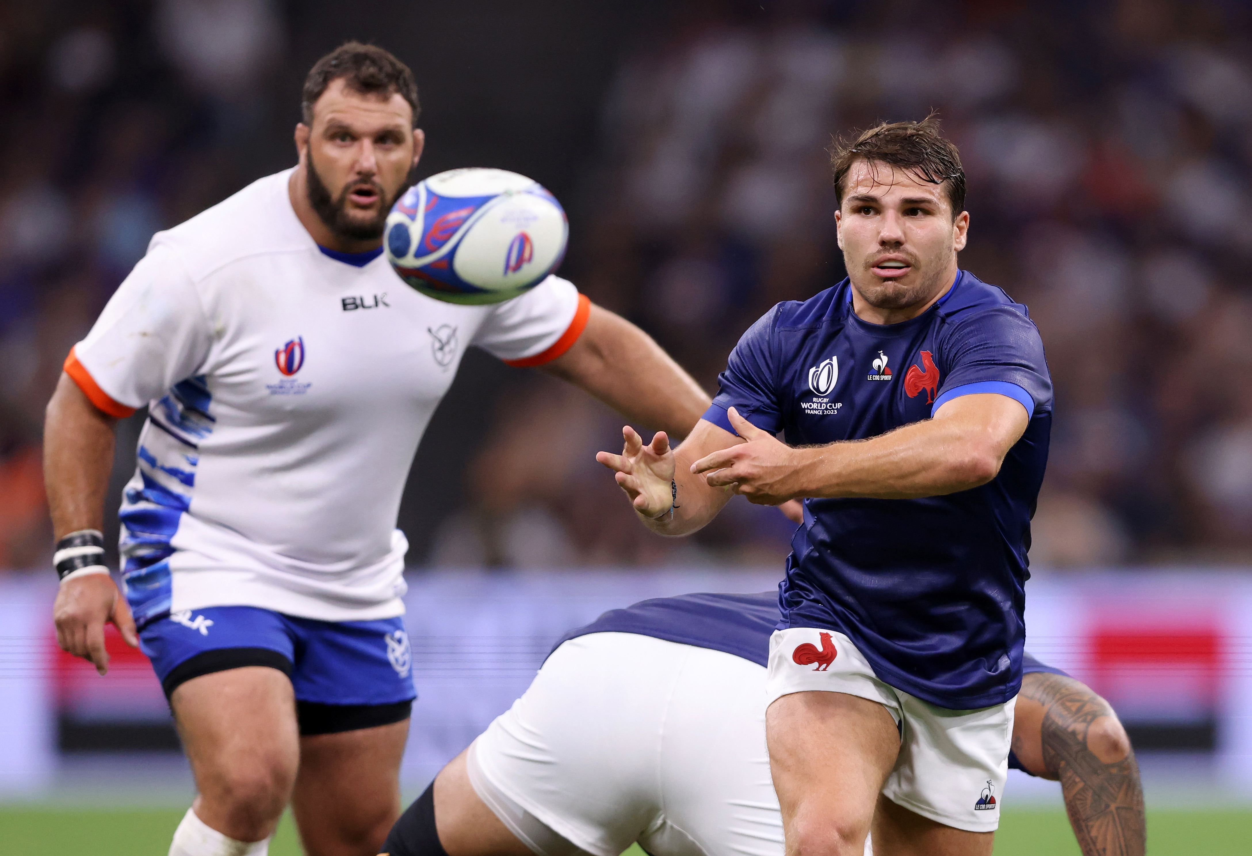 Antoine Dupont passes the ball in France's match against Namibia.