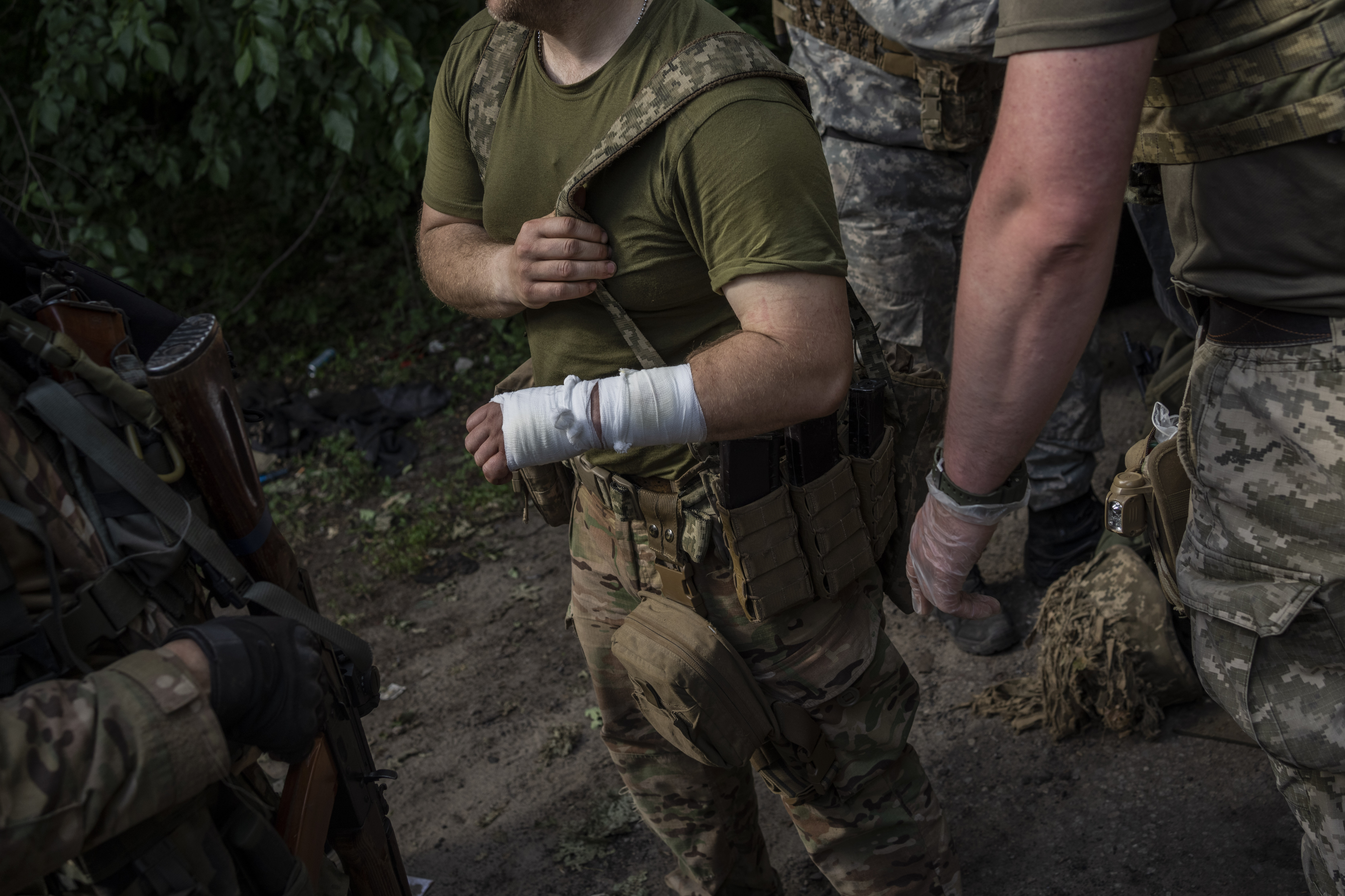 serviceman is evacuated to an aid station in a town near the frontline in Donetsk oblast region, eastern Ukraine, Sunday, June 5, 2022. (AP Photo/Bernat Armangue)