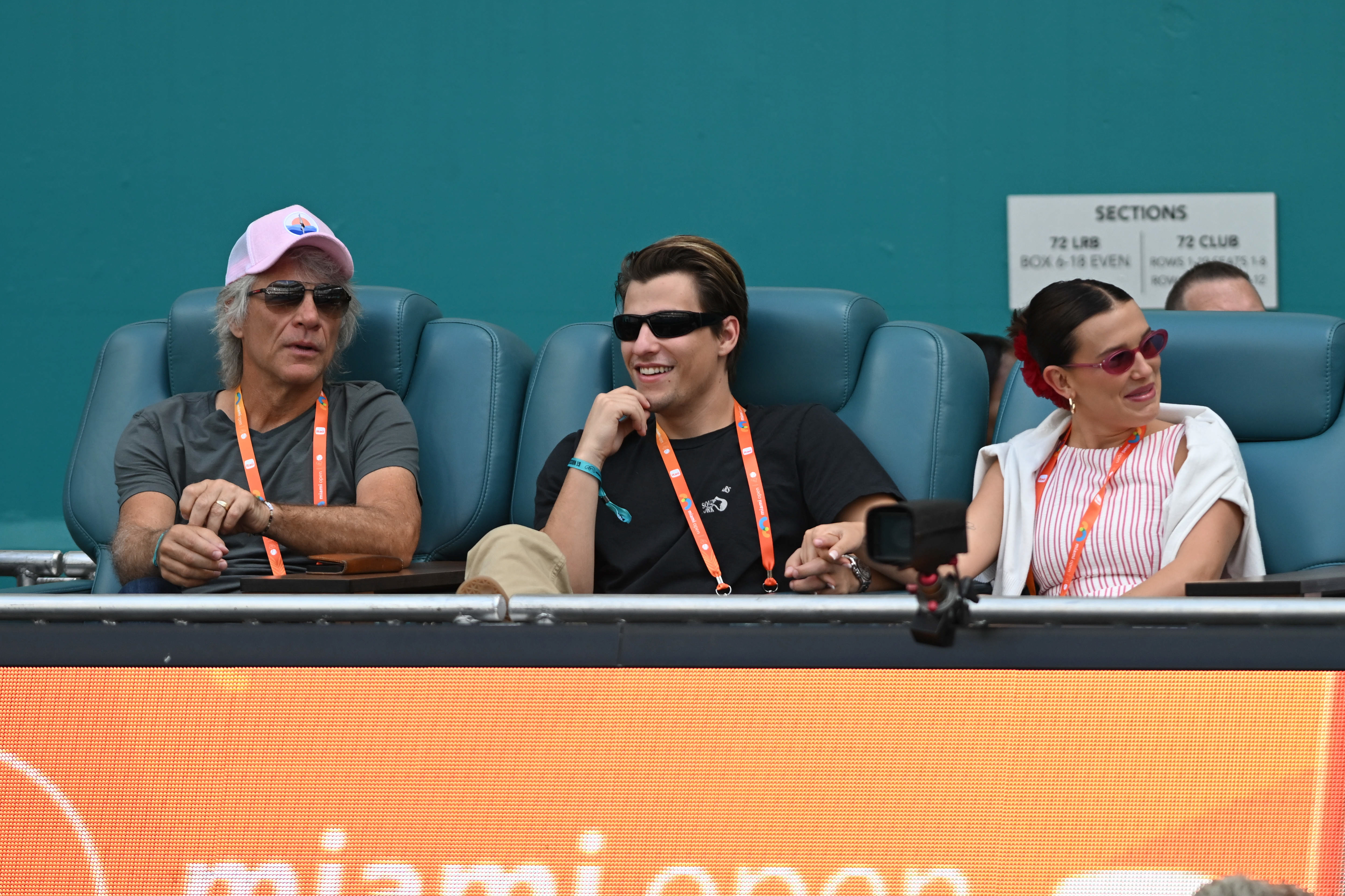  Jon Bon Jovi, from left, Jake Bongiovi and Millie Bobby Brown are seen during the women's semifinals match at the Miami Open on March 27, 2025, at Hard Rock Stadium in Miami Gardens, Florida. (Photo by Michele Eve Sandberg/Icon Sportswire via Getty Images)