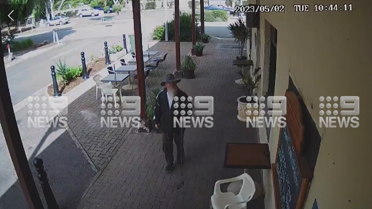 Sean Ferris walking his dog outside Foodland in South Australia.