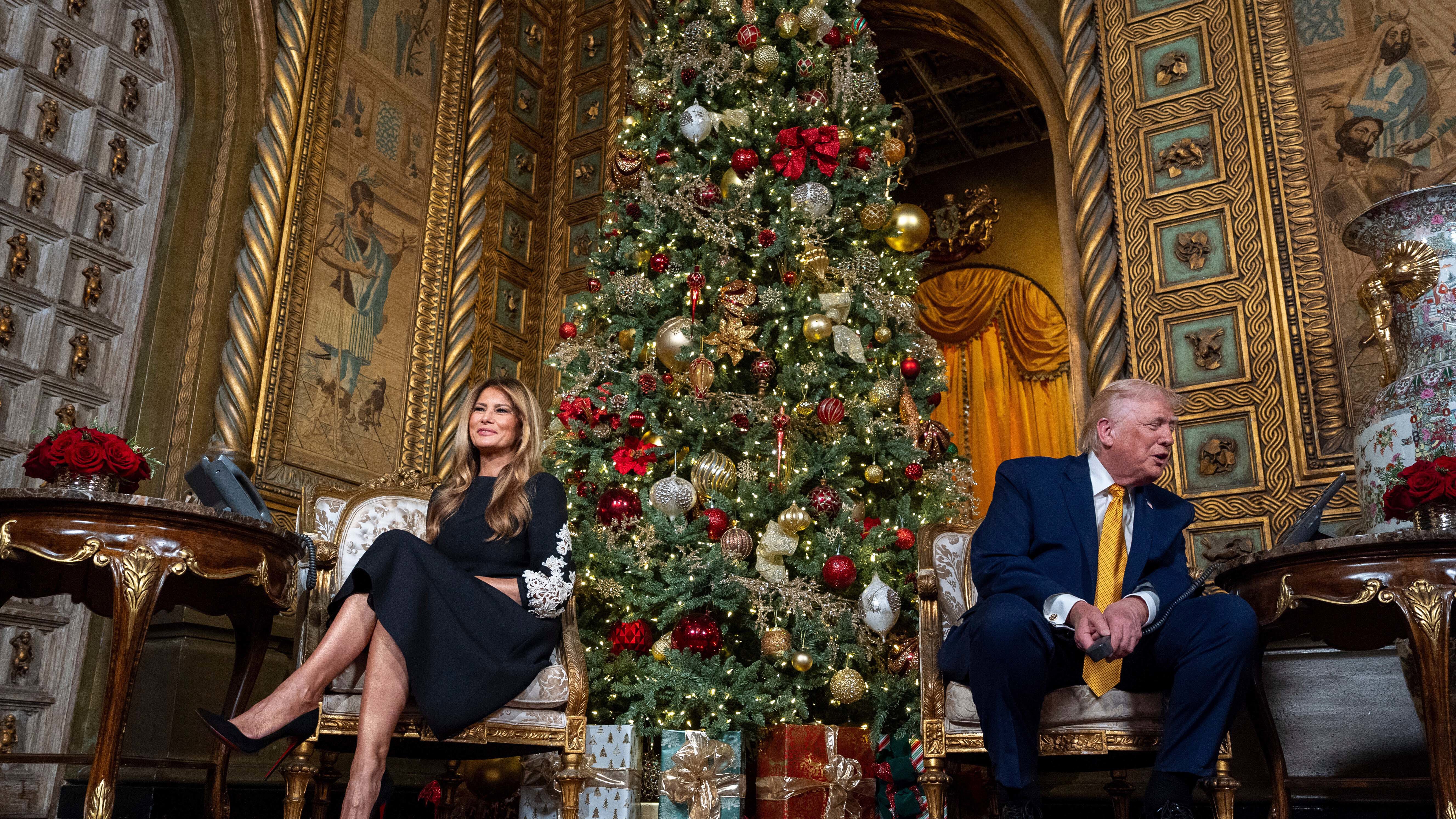 President Donald Trump, speaks accompanied by first lady Melania Trump, during a NORAD, North American Aerospace Defense Command, Tracks Santa Operation call at his Mar-a-Lago club.