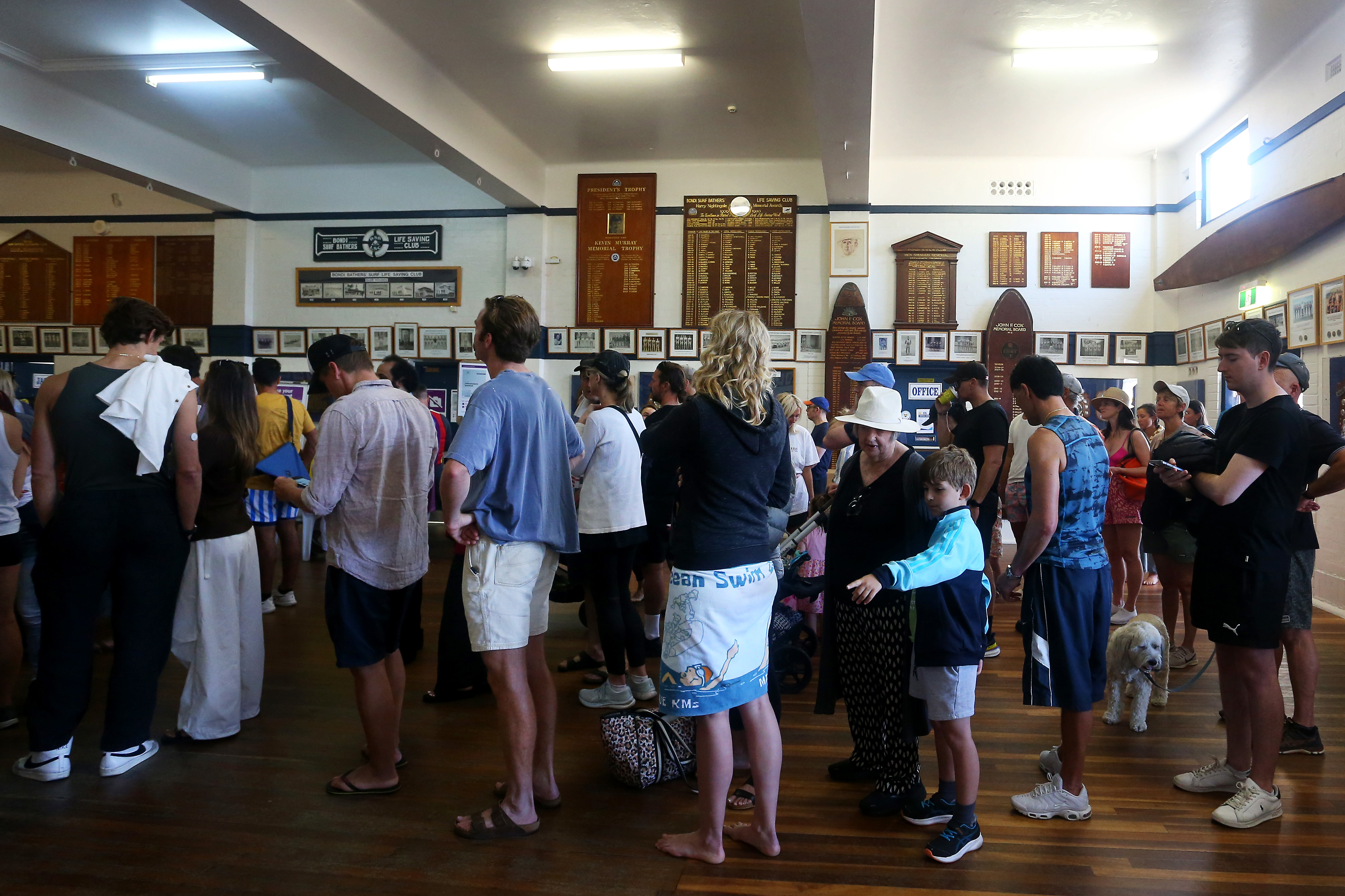 Members of the public queue to cast their vote at a polling centre