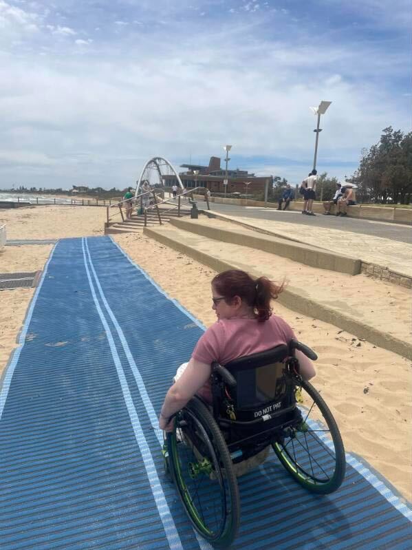 Beach matting allows people who use wheelchairs to reach the water's edge.