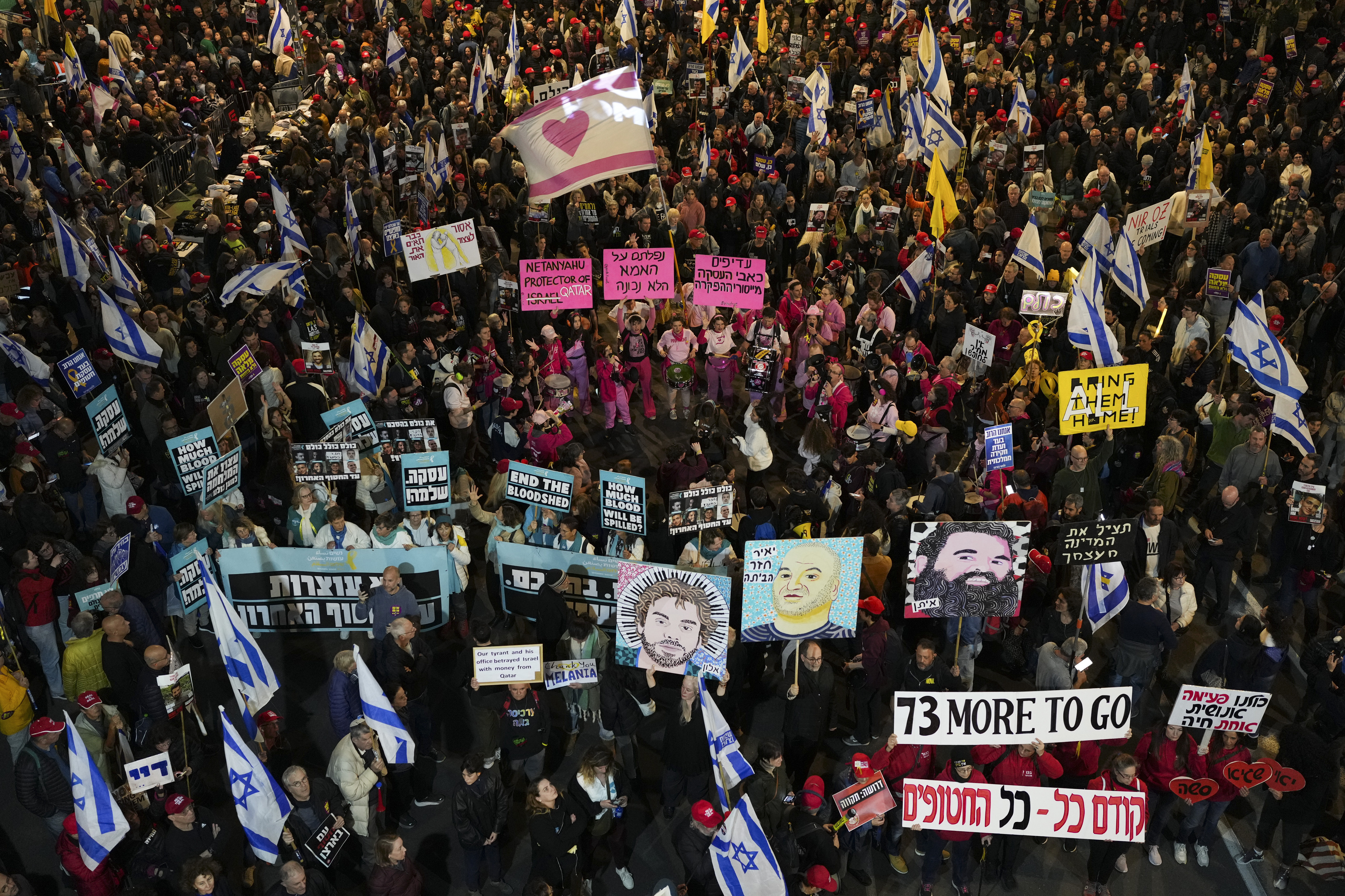 Protesters demanding the immediate release of hostages held by Hamas in the Gaza Strip, in Tel Aviv, Israel, Saturday, Feb. 15, 2025. (AP Photo/Ohad Zwigenberg)