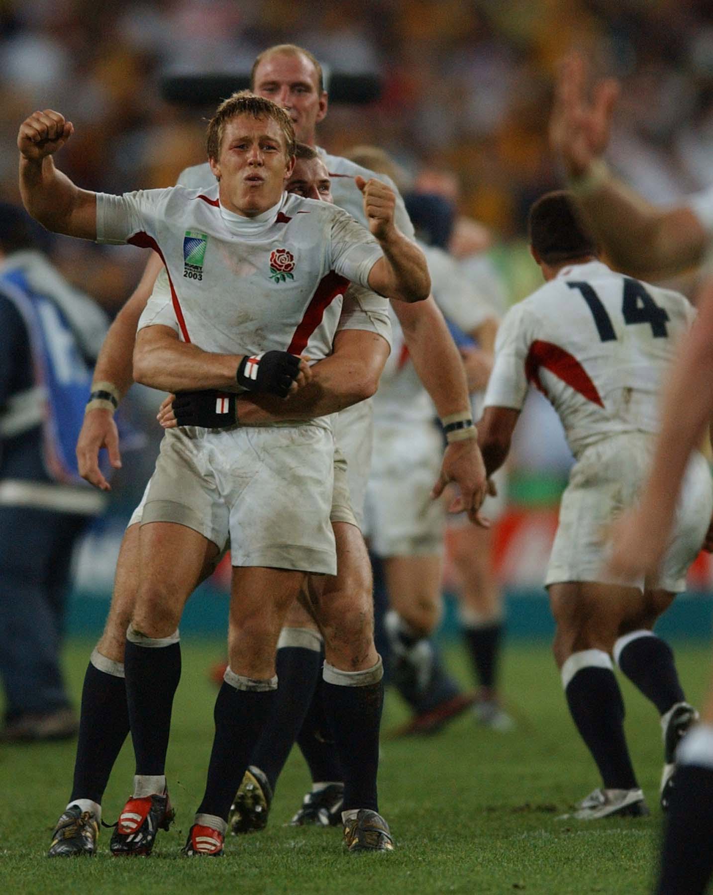 England's match winning hero Jonny Wilkinson is hugged by Ben Cohen on the final whistle.