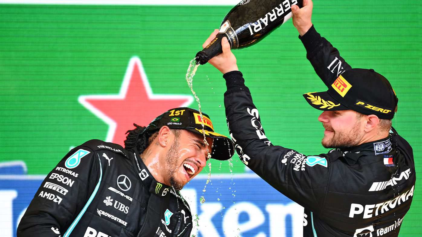 Race winner Lewis Hamilton of Great Britain and Mercedes GP and third placed Valtteri Bottas of Finland and Mercedes GP celebrate