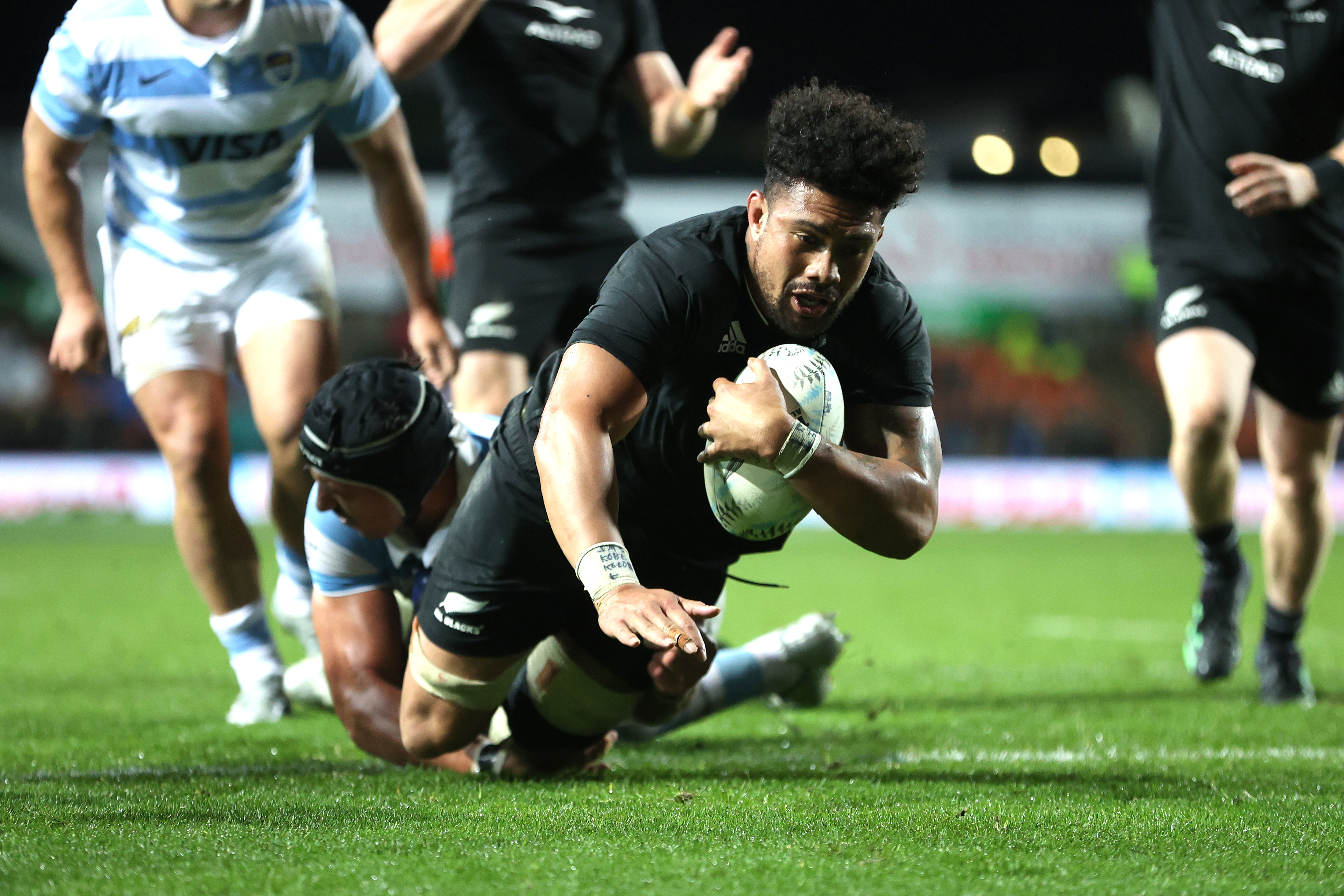 Ardie Savea of New Zealand scores a try.