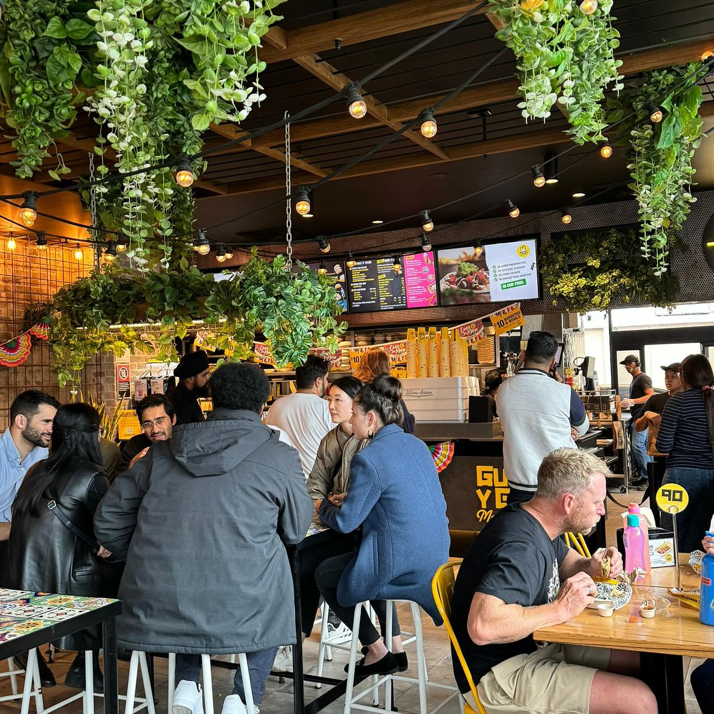 Customers in a Guzman y Gomez store.