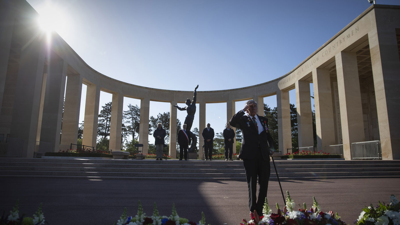 Charles Norman Shay, D-Day WWII veteran and Penobscot Elder from Maine, salutes after laying a wreath during a D-Day 76th anniversary ceremony at the Normandy American Cemetery in Colleville-sur-Mer, Normandy, France, Saturday, June 6, 2020