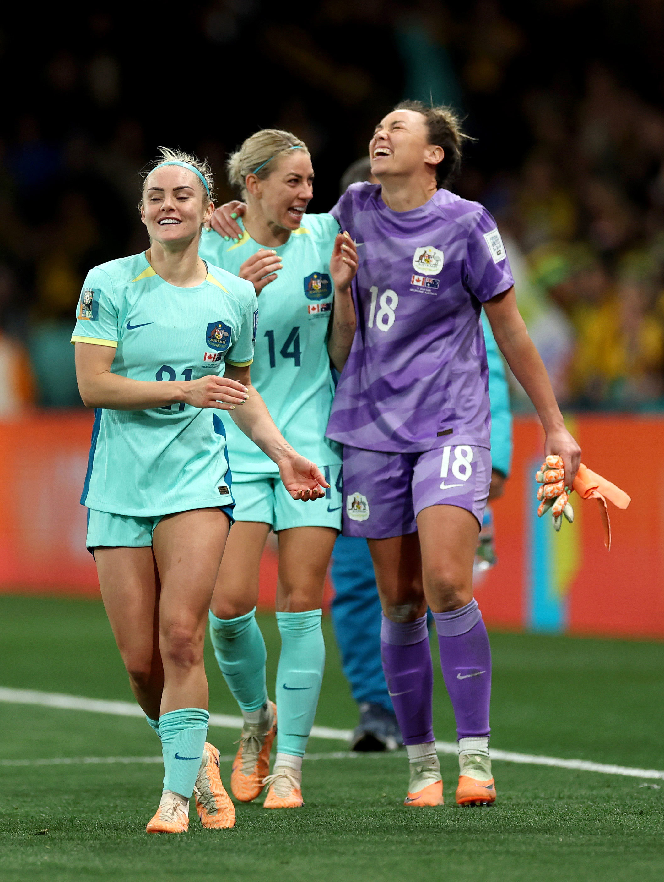 Ellie Carpenter, Alanna Kennedy and Mackenzie Arnold celebrate the team's 4-0 victory over Canada,