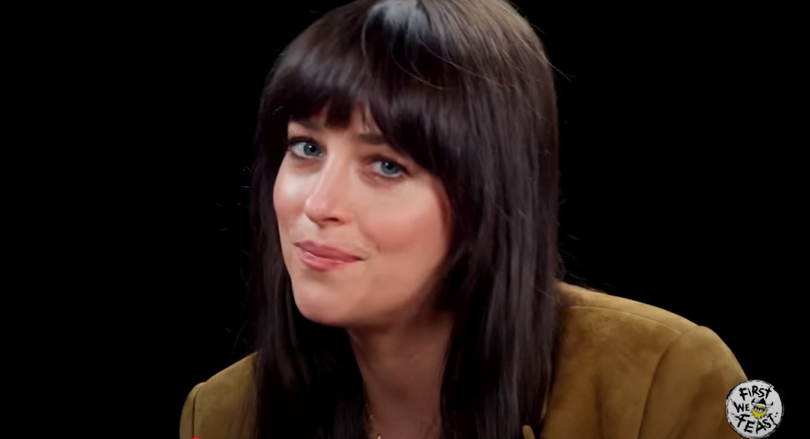 Dakota Johnson jokes about Madame Web backlash during an interview on Hot Ones