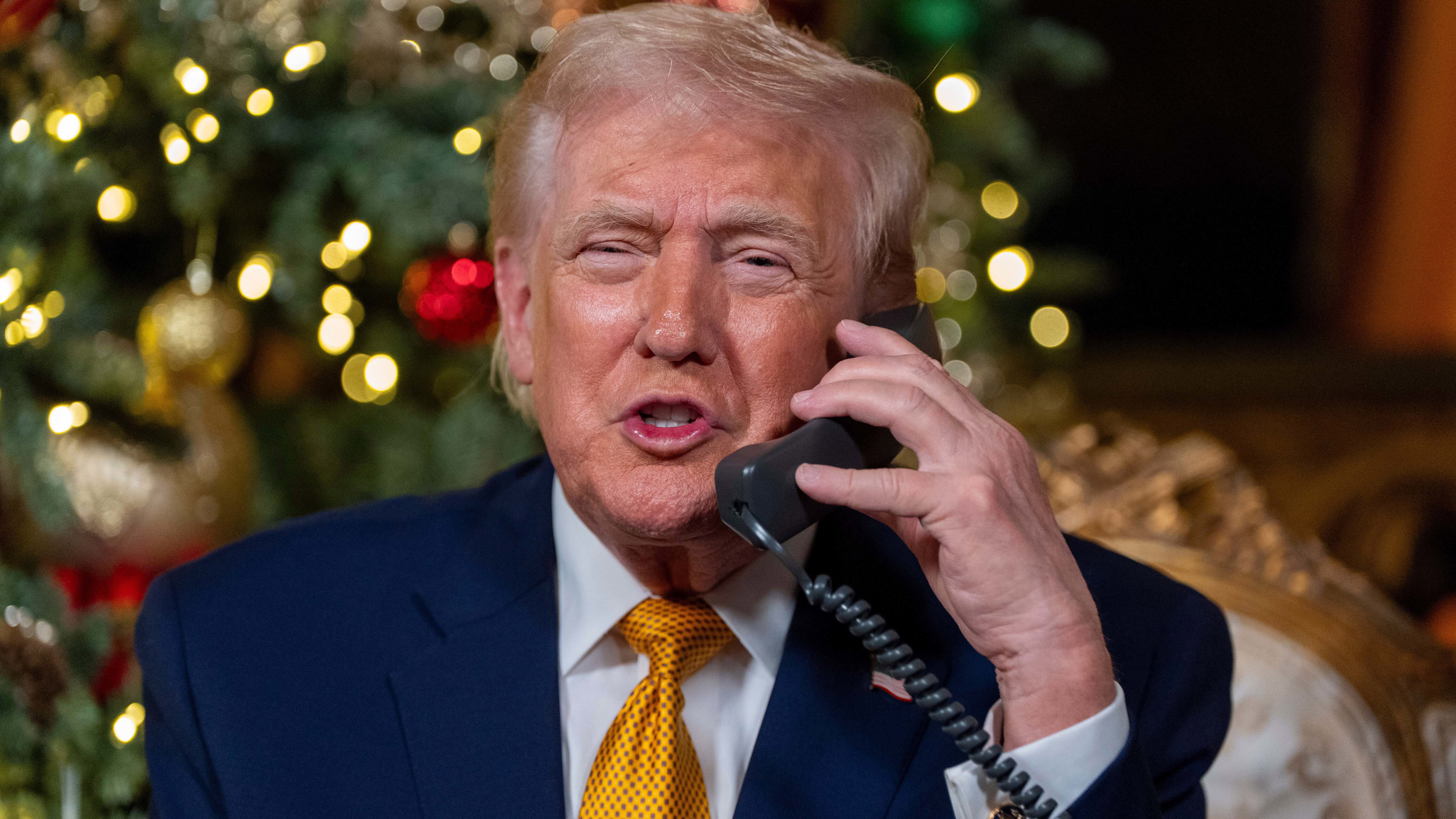 President Donald Trump speaks during a NORAD, North American Aerospace Defense Command, Tracks Santa Operation call at his Mar-a-Lago club.