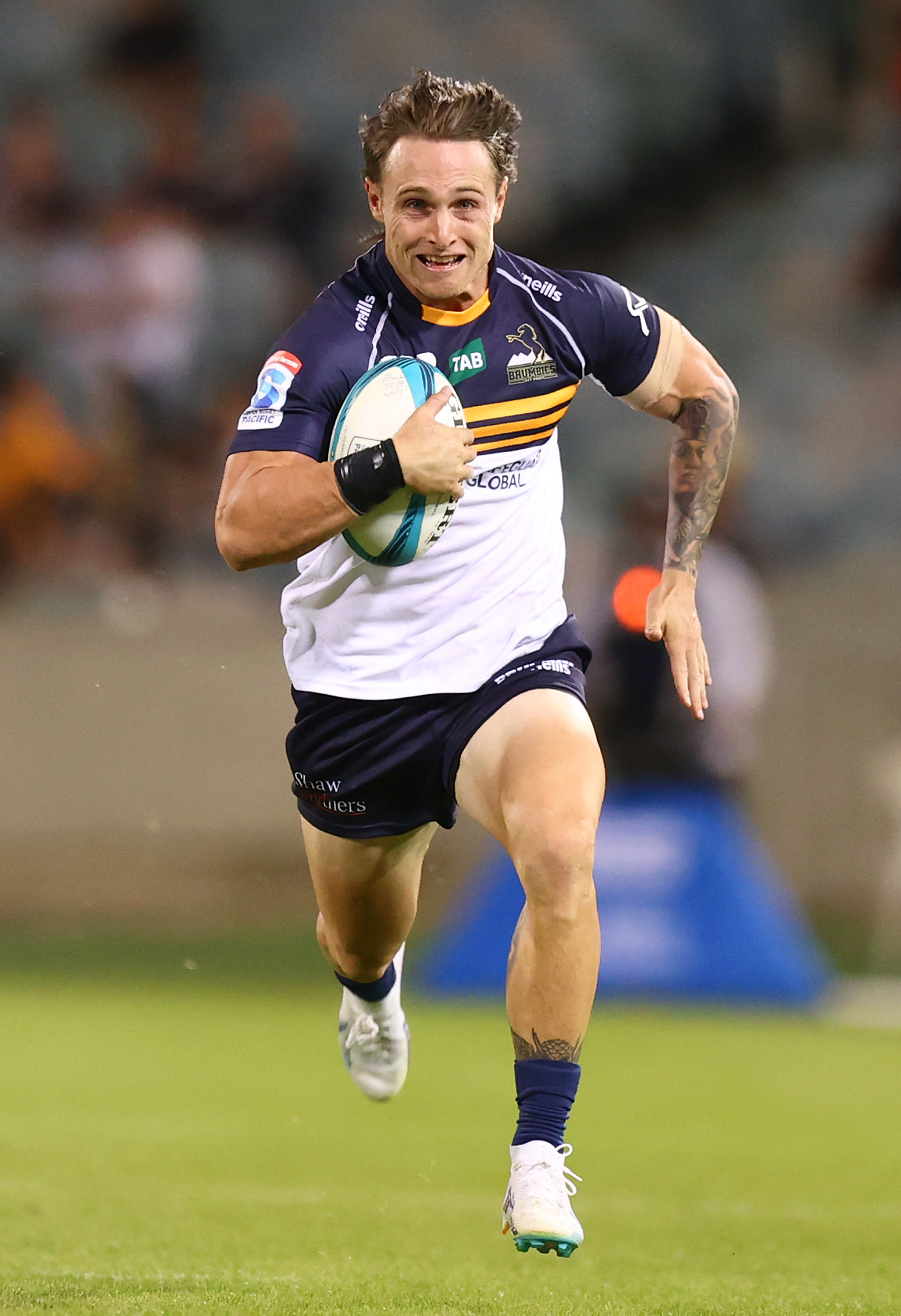 Corey Toole of the Brumbies makes a line break.