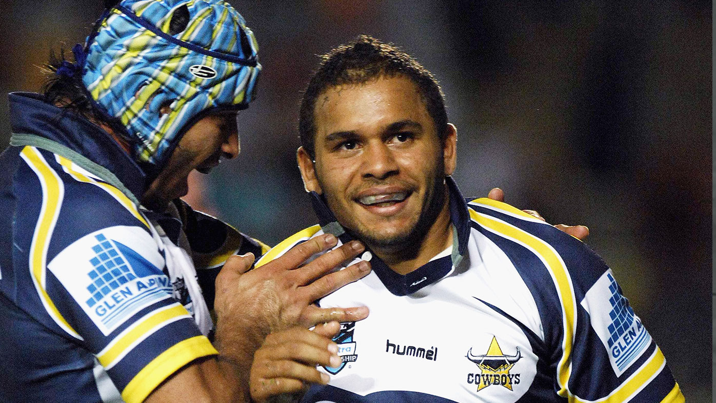 Johnathan Thurston and Matt Bowen embrace