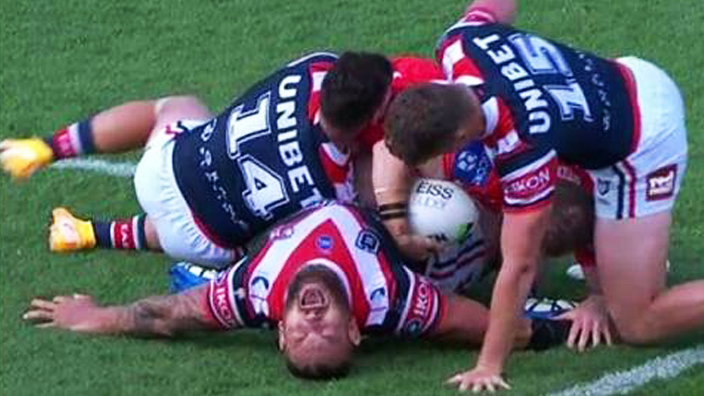 Waerea-Hargreaves gets crushed under a horror tackle.