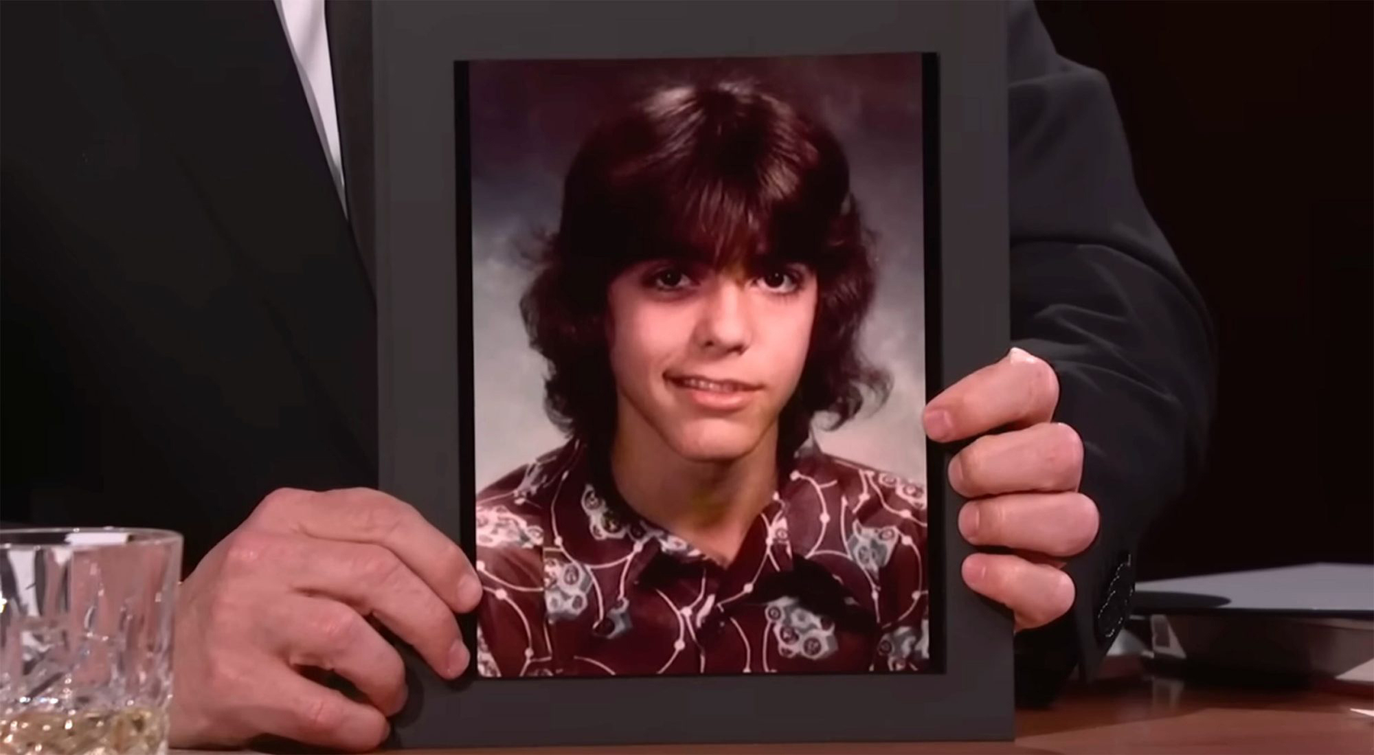 George Clooney appears in a high school photo while suffering from Bells palsy.