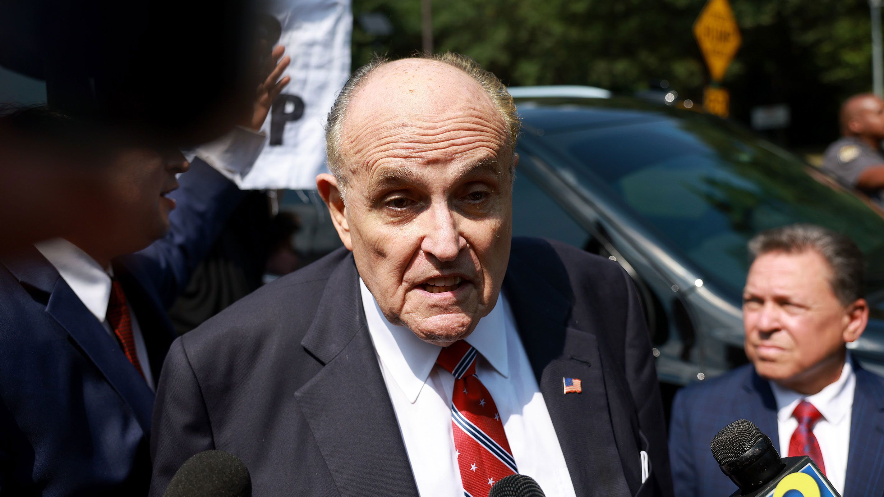 Rudy Giuliani speaks to the media after leaving the Fulton County jail on August 23 in Atlanta.