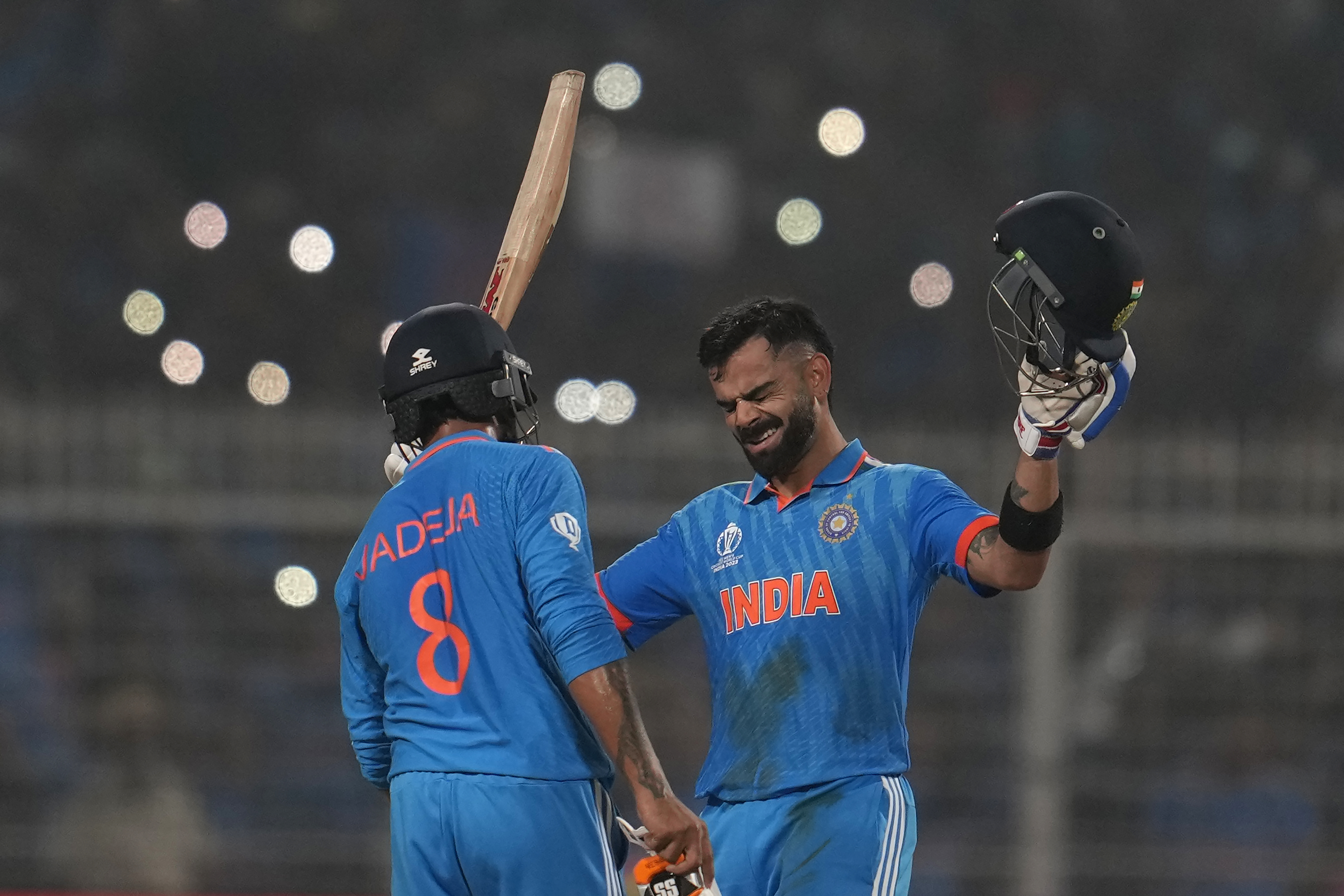 India's Virat Kohlpi reacts as he celebrates scoring a century during the ICC Men's Cricket World Cup.
