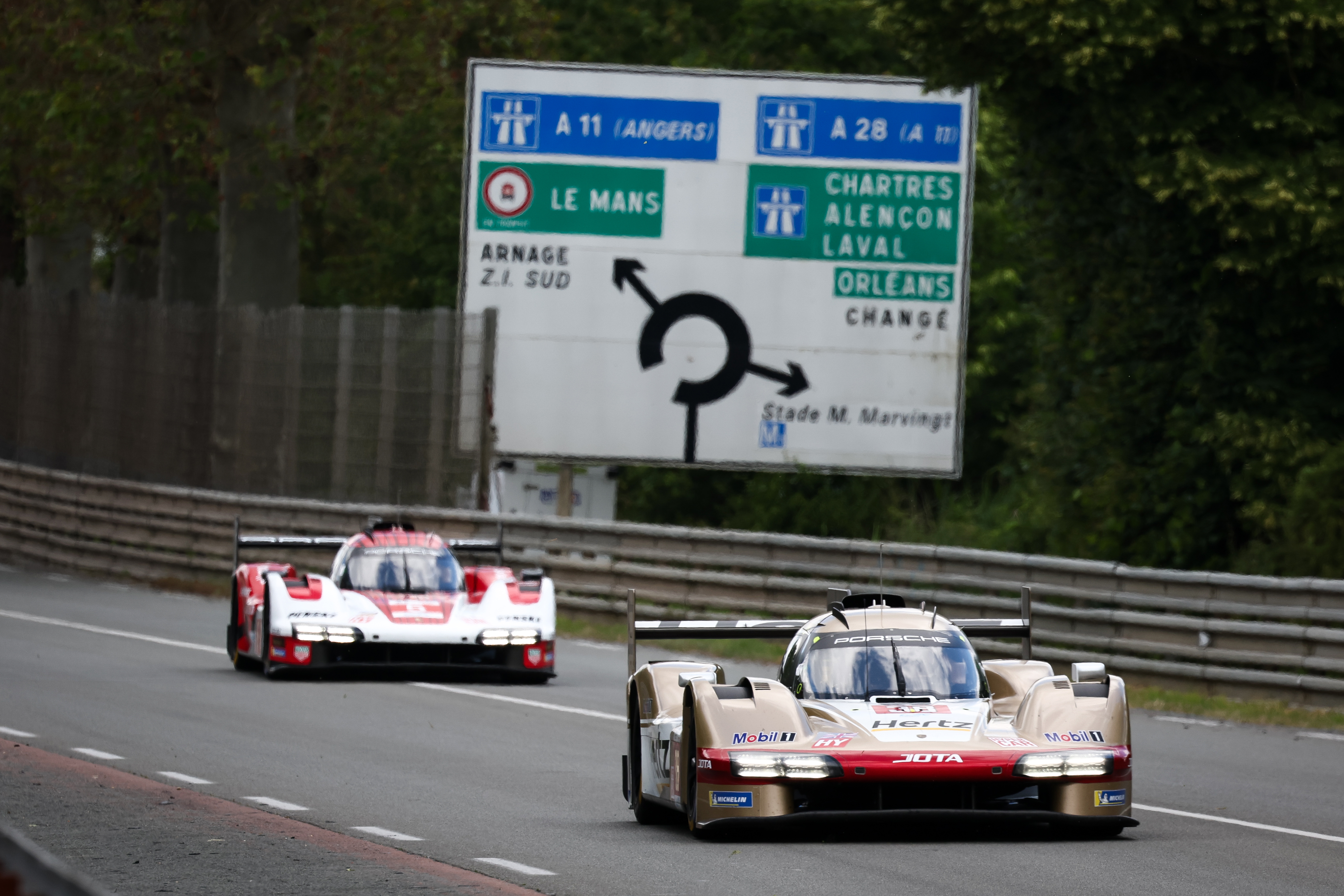 The No.38 Team Jota Porsche 963 of Jenson Button, Philip Hanson, and Oliver Rasmussen in action during the Le Mans test day.