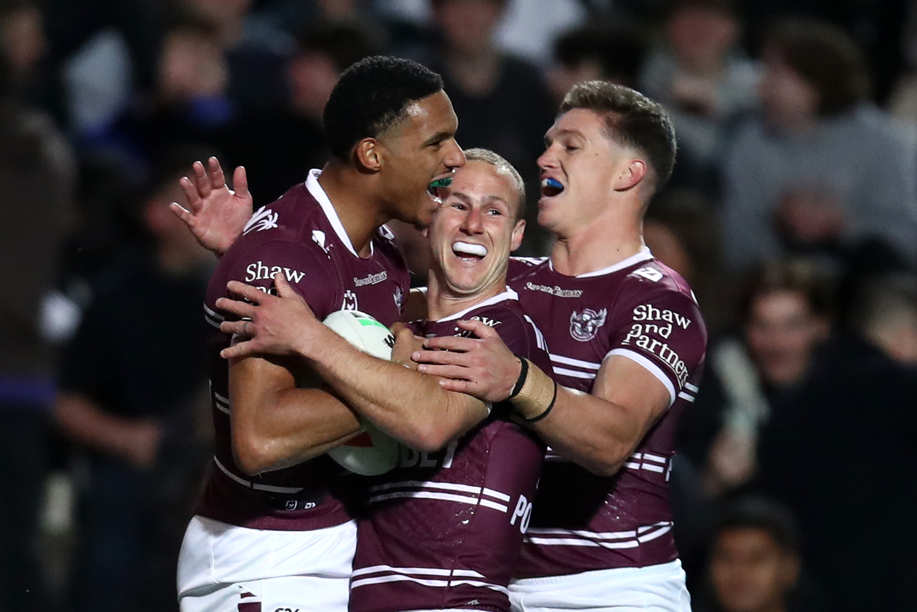 Jason Saab of the Sea Eagles celebrates with team mates after scoring a try during the round 15 NRL match between Manly Sea Eagles and Dolphins at 4 Pines Park on June 09, 2023 in Sydney, Australia. (Photo by Jason McCawley/Getty Images)