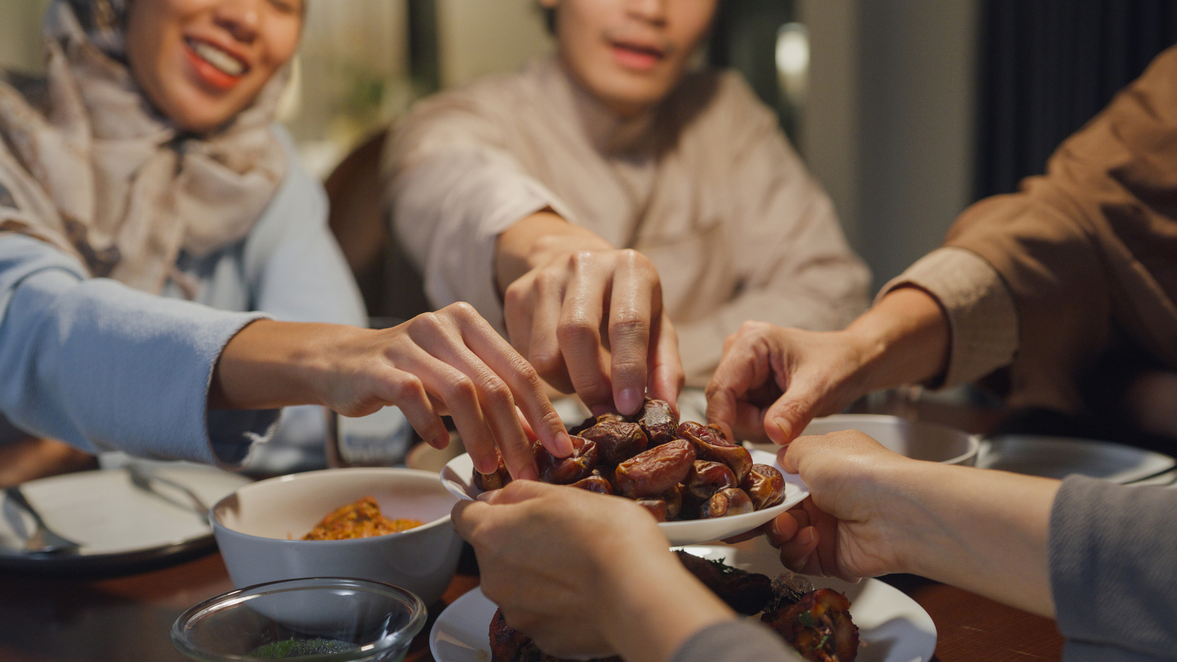 Close-up dates fruit dish Eid Mubarak Muslim Asia family have Iftar dinner to break feast. Traditional food during Ramadan fasting month at home, The Islamic Halal Eating and Drinking at modern Islam.