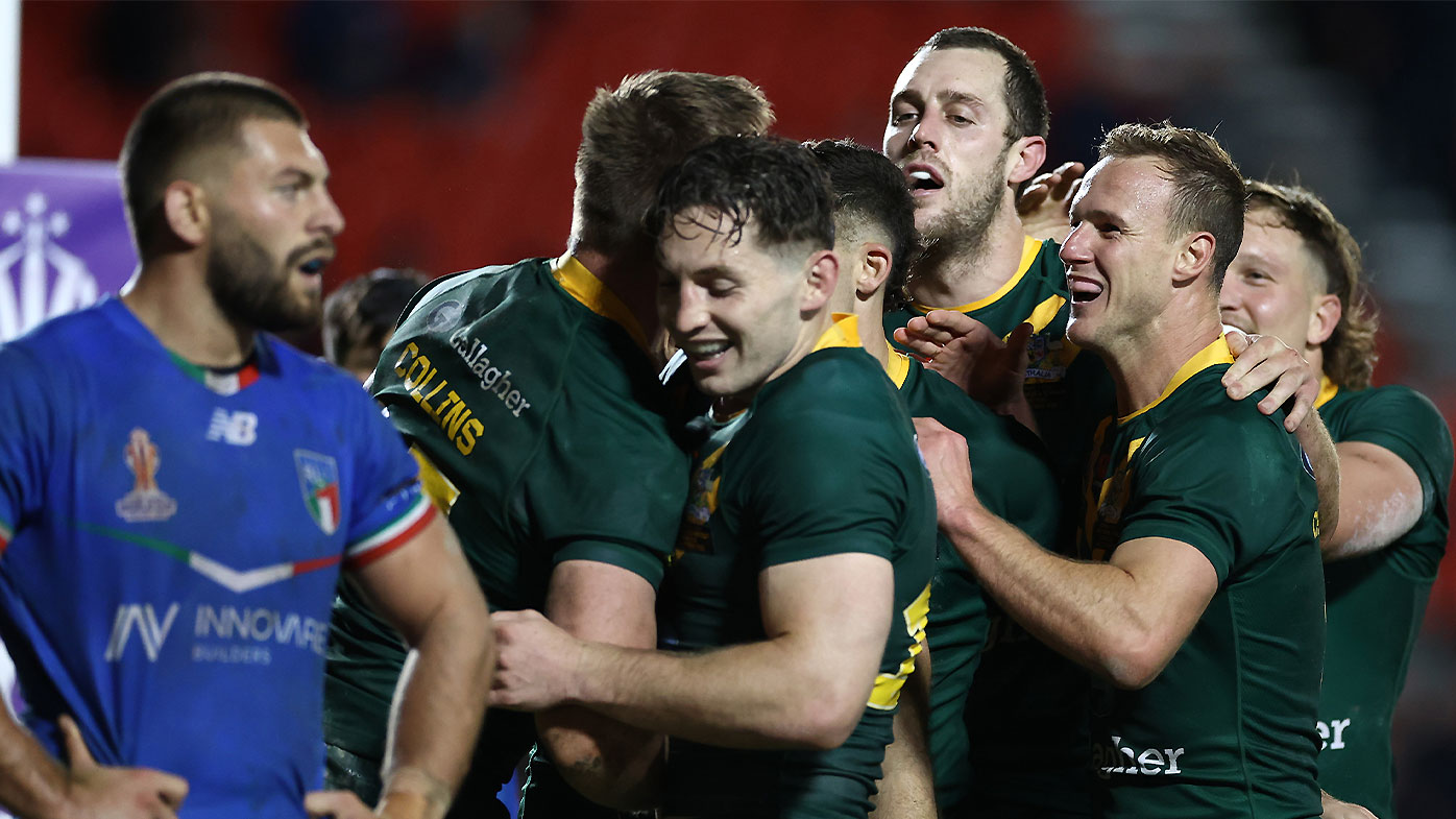 Daly Cherry-Evans celebrates one of Australia's 12 tries in the win against Italy