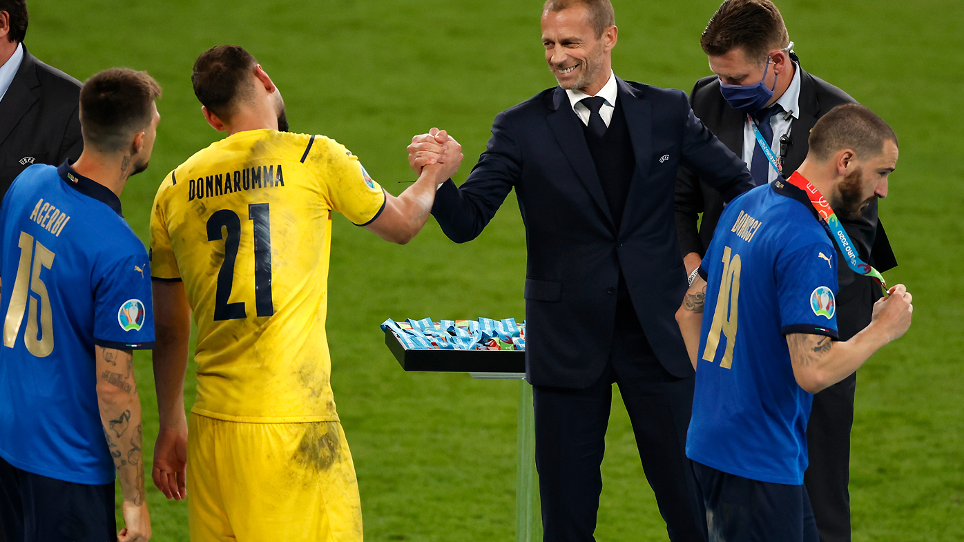 Gianluigi Donnarumma of Italy interacts with Aleksander Ceferin