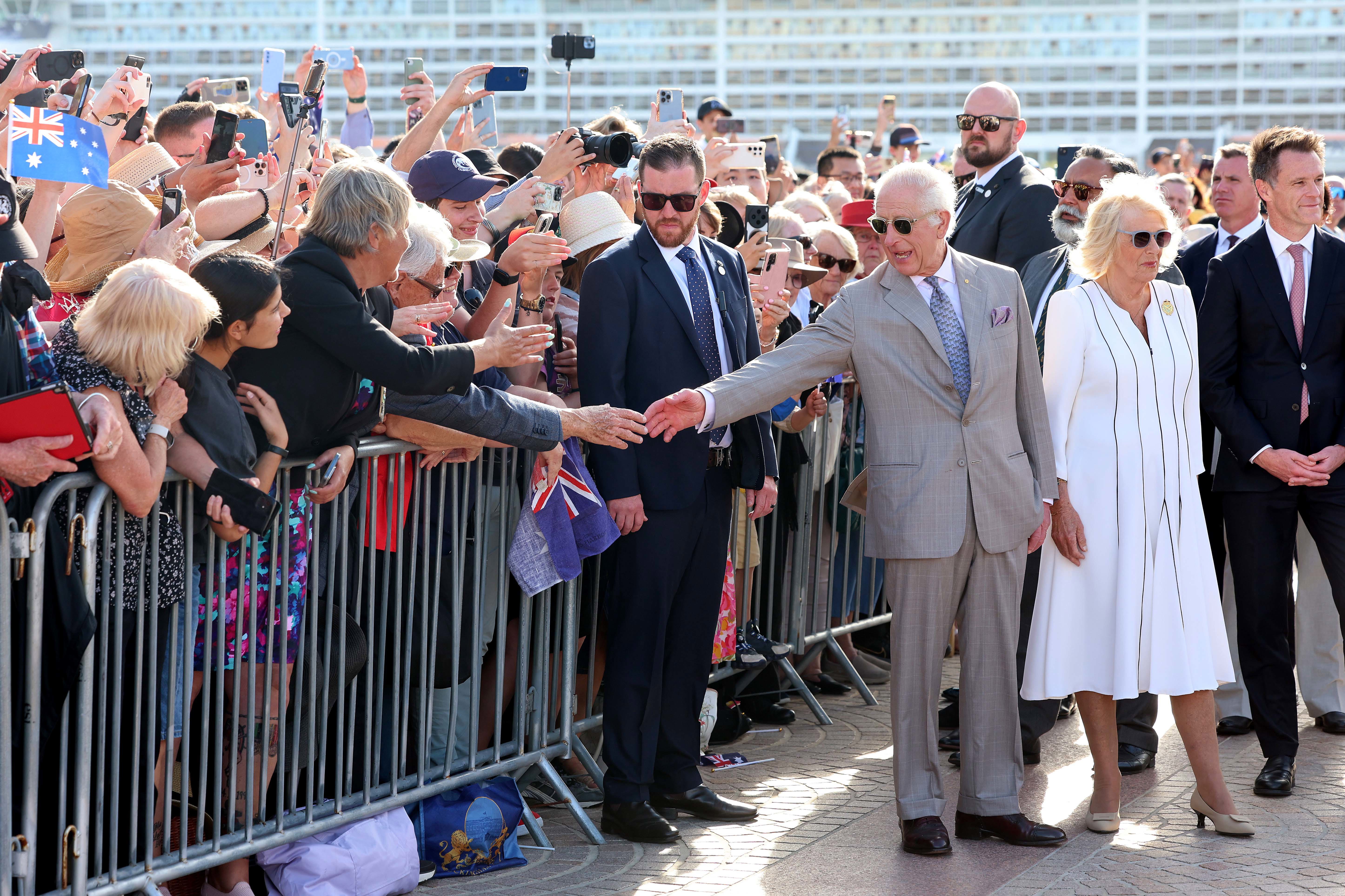 SYDNEY, AUSTRALIA - OCTOBER 22: King Charles III greets a spectator as he arrives at the Sydney Opera House on October 22, 2024 in Sydney, Australia. The King's visit to Australia is his first as monarch, and the Commonwealth Heads of Government Meeting (CHOGM) in Samoa will be his first as head of the Commonwealth. (Photo by Chris Jackson/Getty Images)