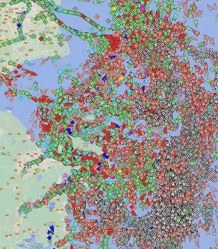 Image shows ships siting idly around Shanghai causing global shipping delays.