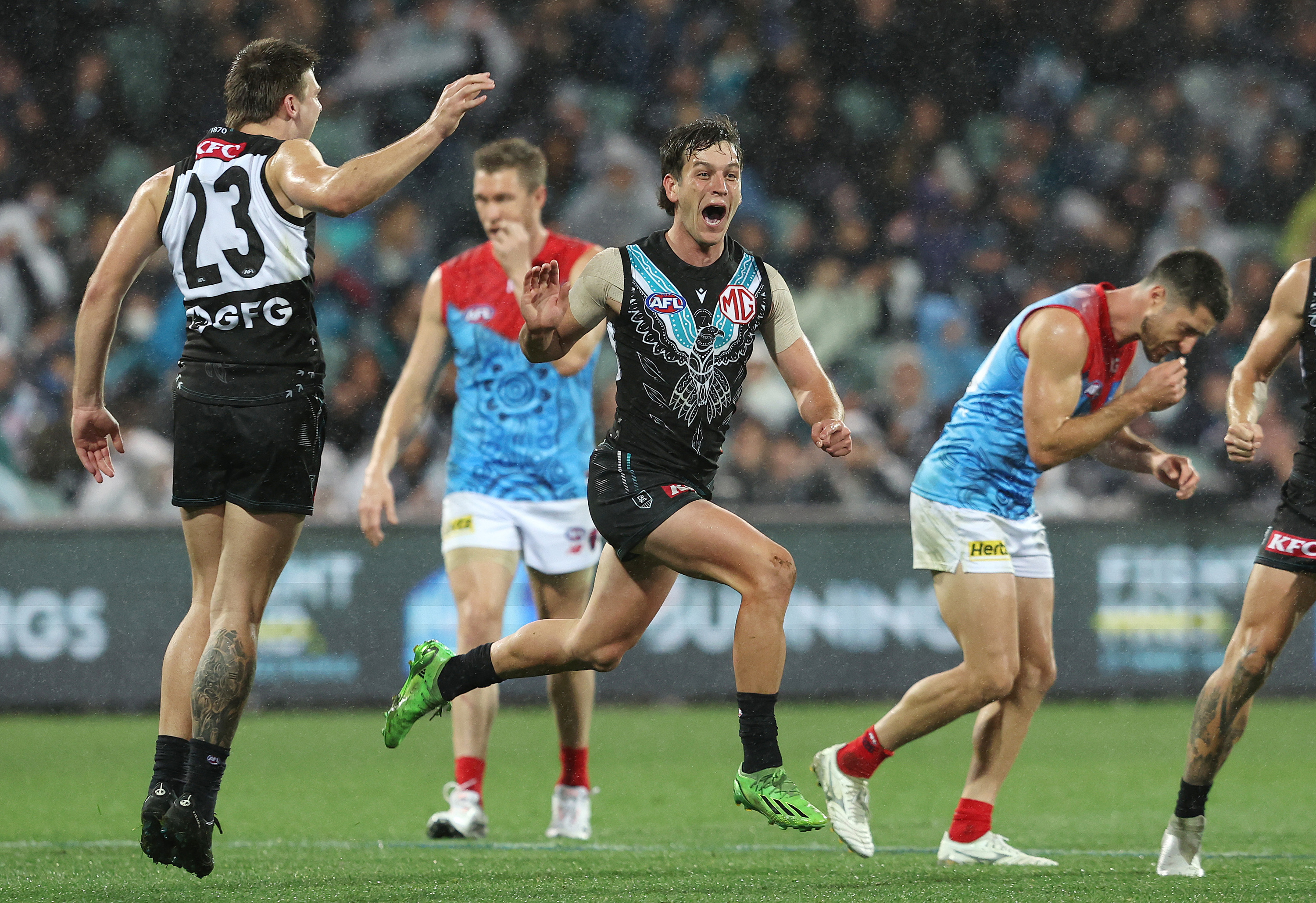 ADELAIDE, AUSTRALIA - MAY 19: Zak Butters of the Power celebrates a goal during the 2023 AFL Round 10 match between Yartapuulti/Port Adelaide Power and Narrm/Melbourne Demons at Adelaide Oval on May 19, 2023 in Adelaide, Australia. (Photo by Sarah Reed/AFL Photos)