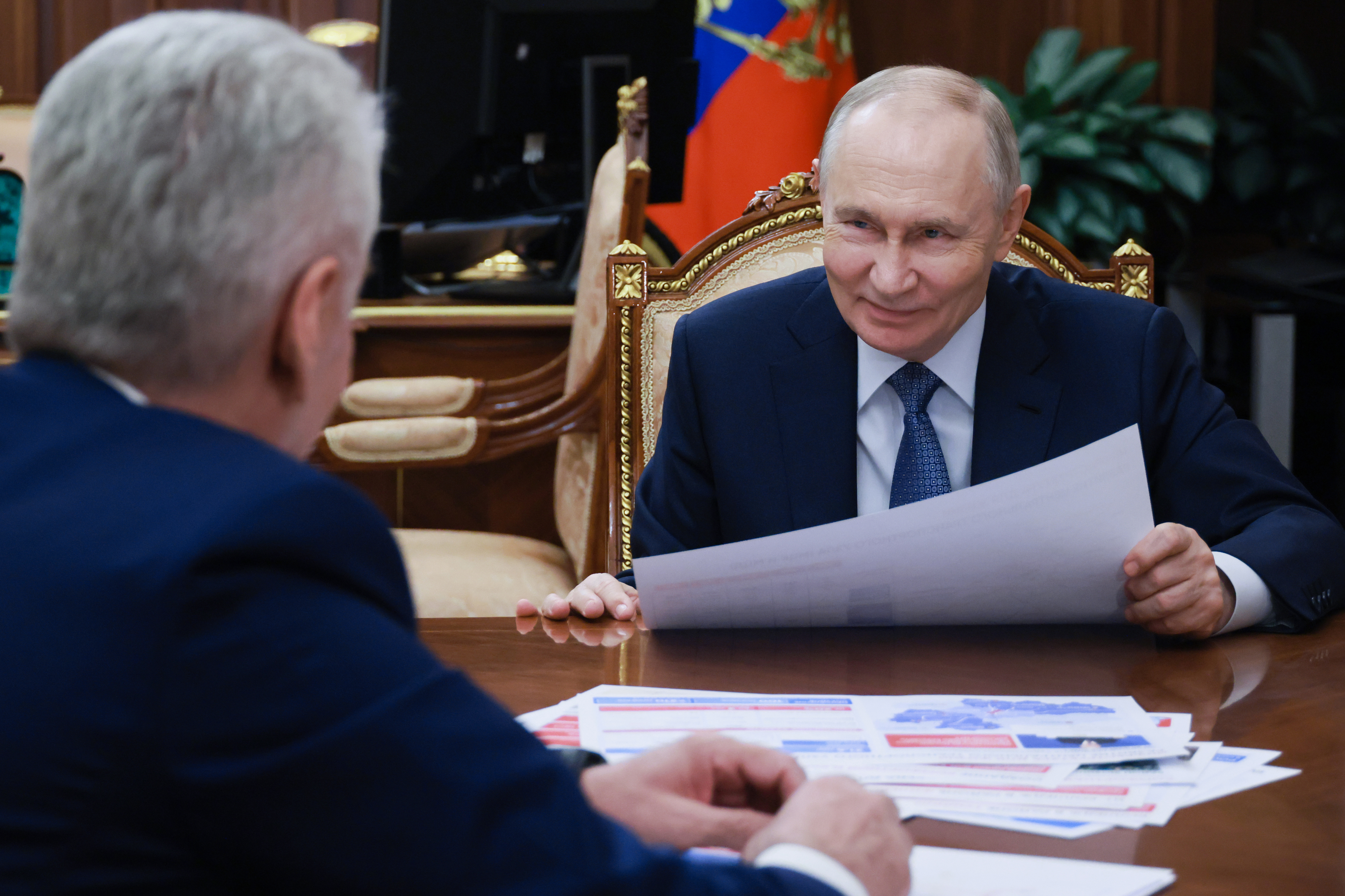 Russian President Vladimir Putin, right, listens to Moscow Mayor Sergei Sobyanin