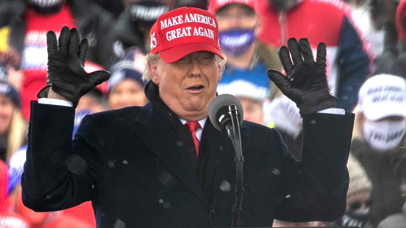 President Donald Trump addresses supporters at a campaign rally in Washington, Michigan.