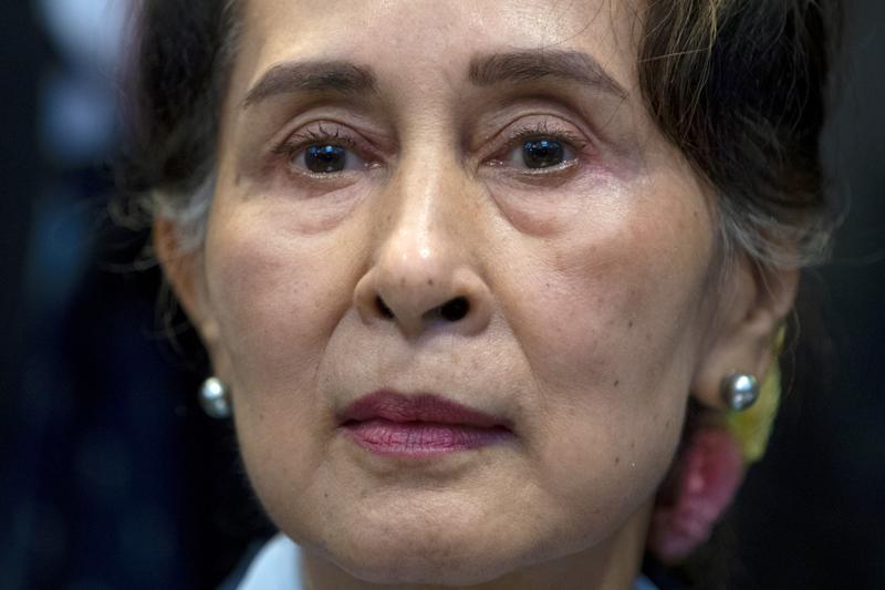 Myanmar puts Suu Kyi on trial on charges critics call bogus