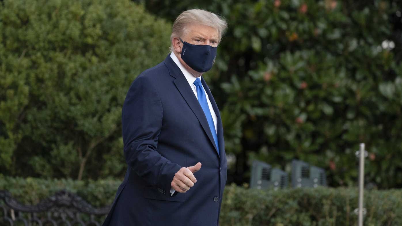 President Donald Trump gives thumbs up as he leaves the White House to go to Walter Reed National Military Medical Centre.